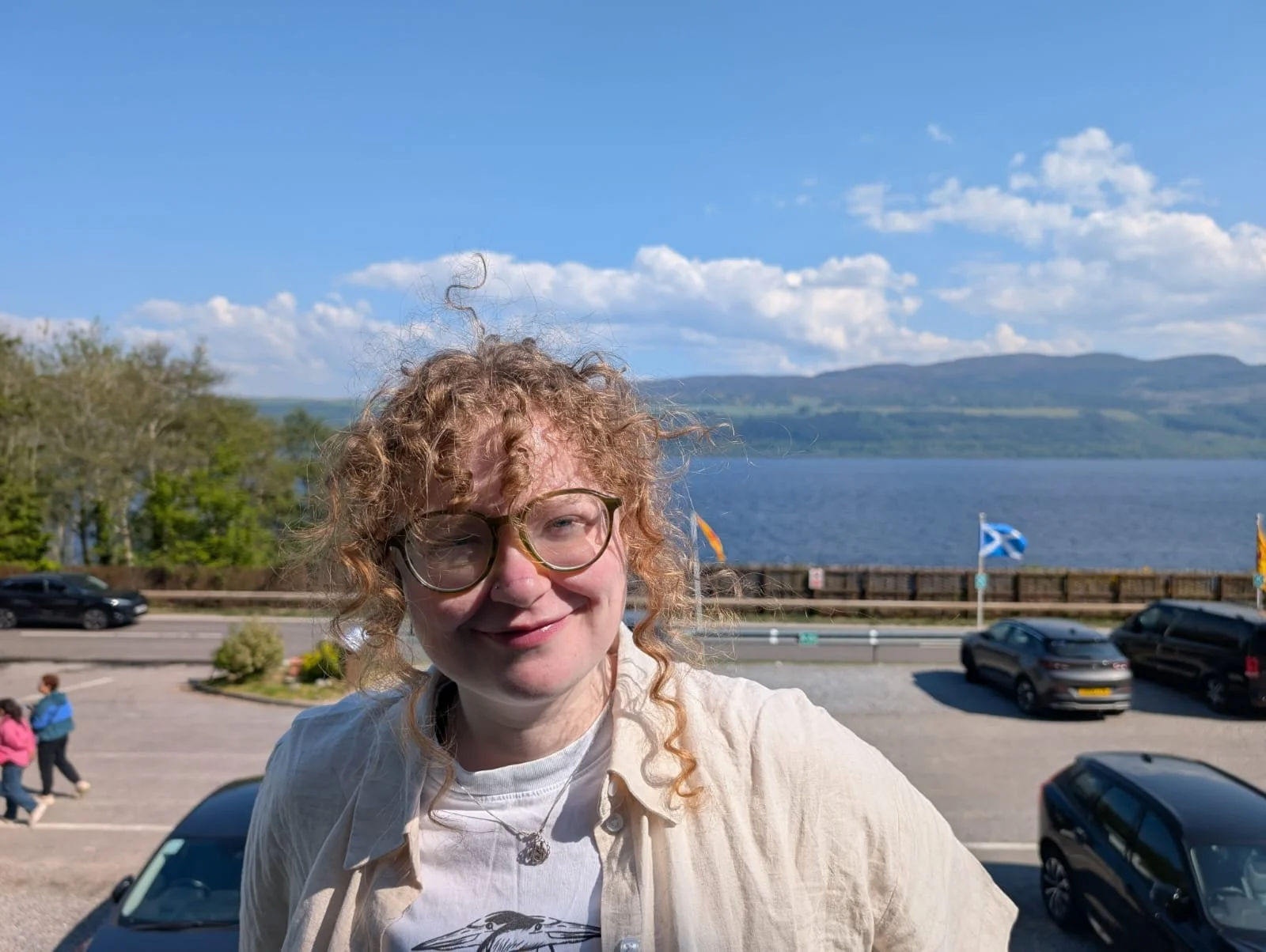 Photo of Carlie outside in front of a loch