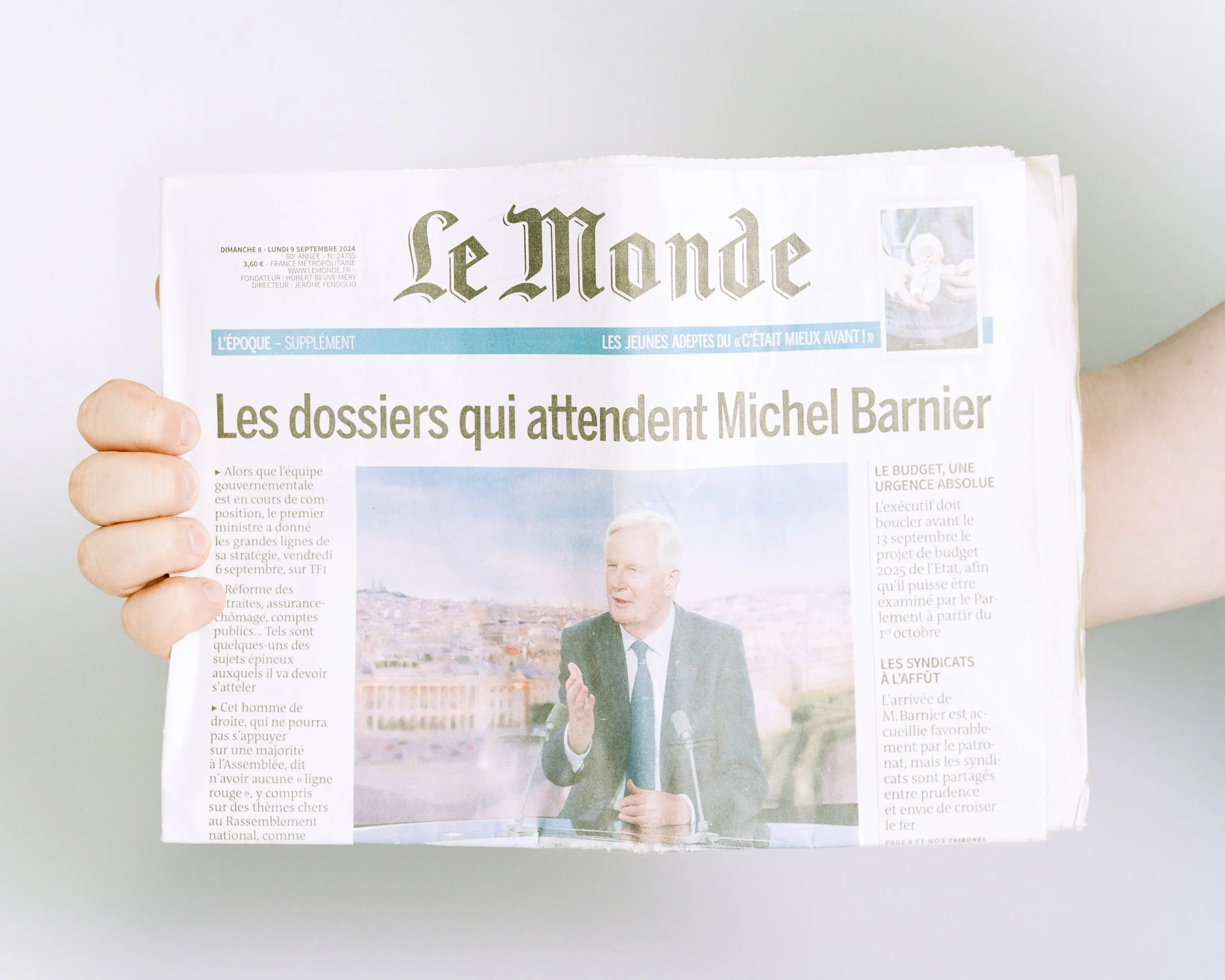 Copy of 'Le Monde' following the appointment of centre right politician Michel Barnier as French Prime Minister. Barnier would govern France for four months before resigning. Newspaper is from Banyuls-Sur-Mer, France. Photographed in London, UK.