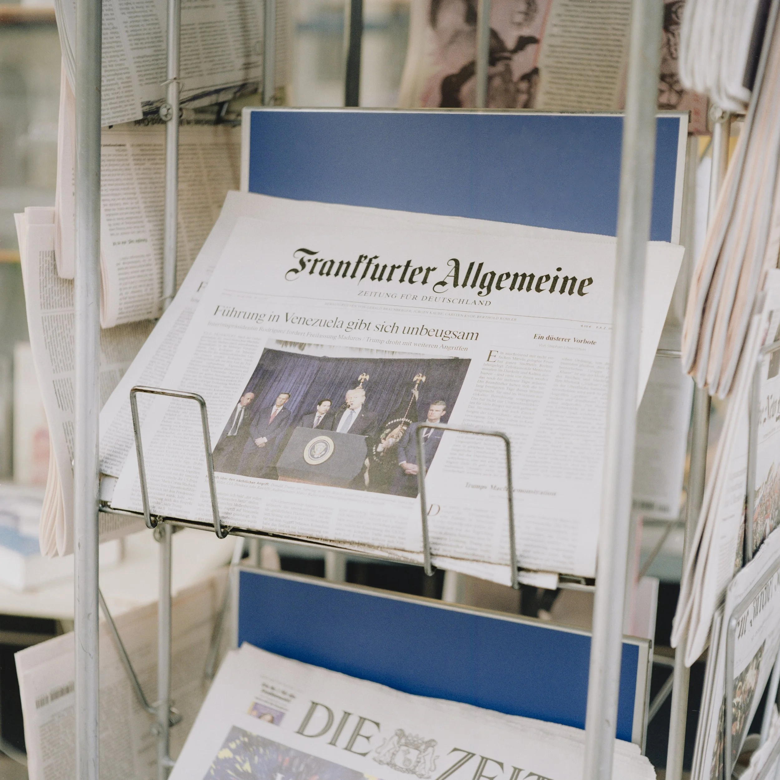 Copy of 'Frankfurter Allgemeine' reporting on unprecedented US military operations in Venezuela. Photograph made on-route to Dessau. Berlin, Germany.
