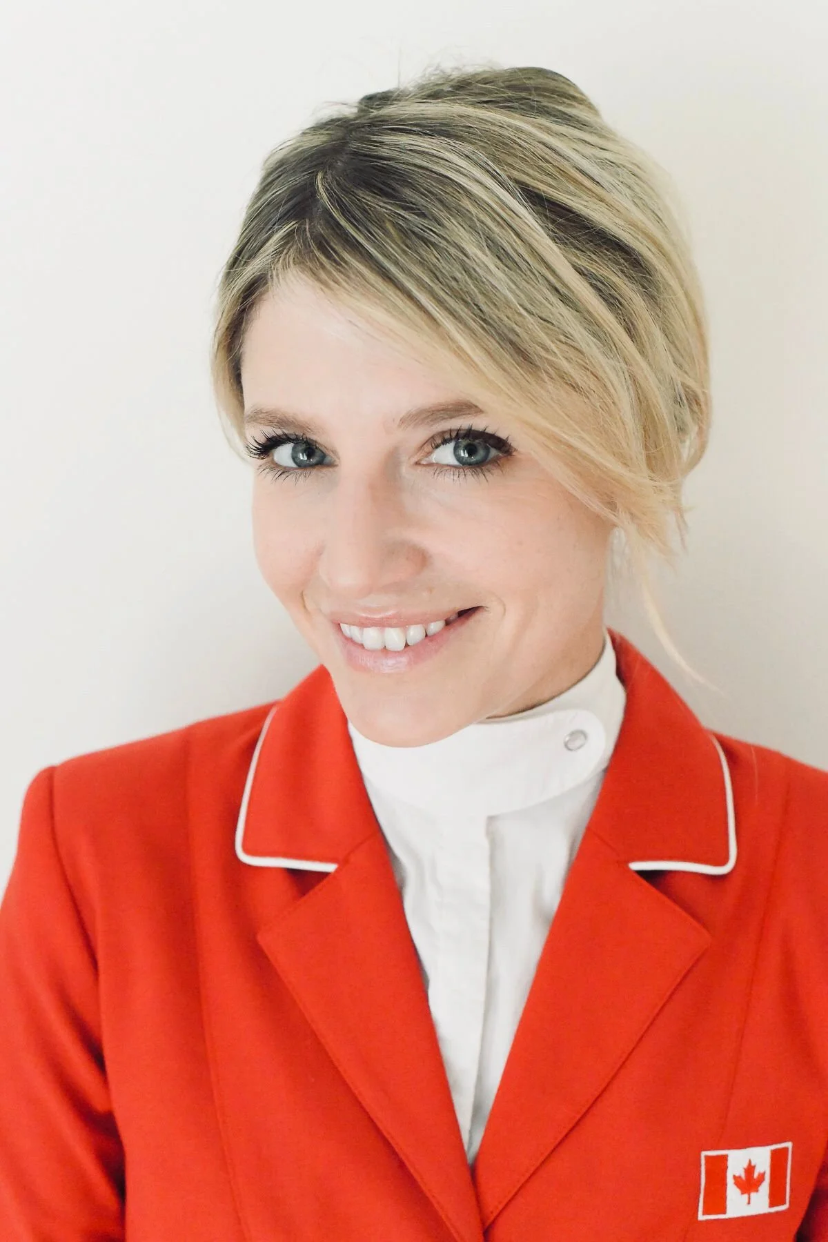 Young blond woman in a red blazer