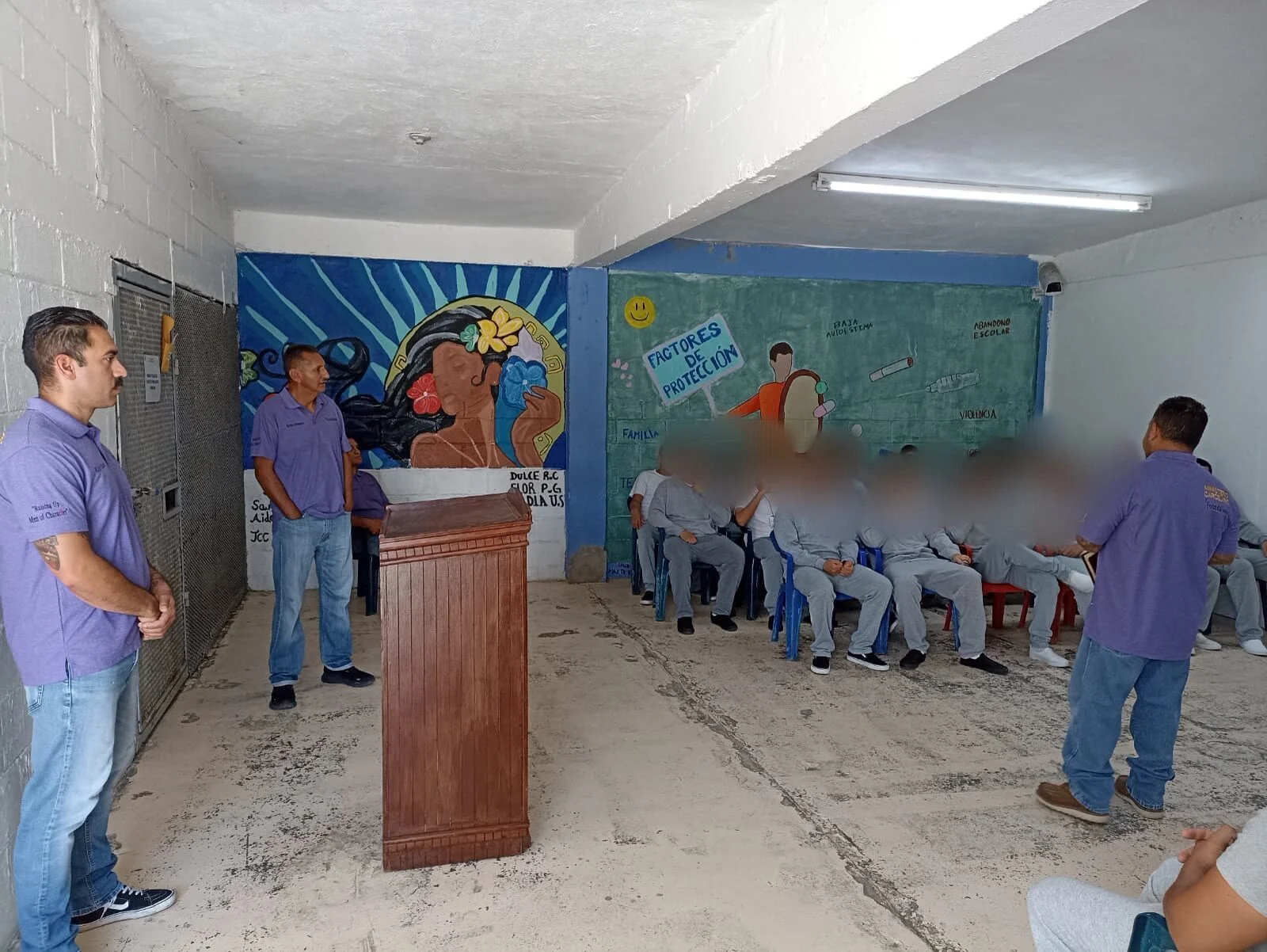 Formation session in mural room with those inside—youth faces blurred for dignity