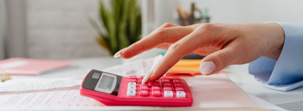 Bookkeeping services Minneapolis MN monthly reconciliation with a calculator and statements by The Cozy Ledger