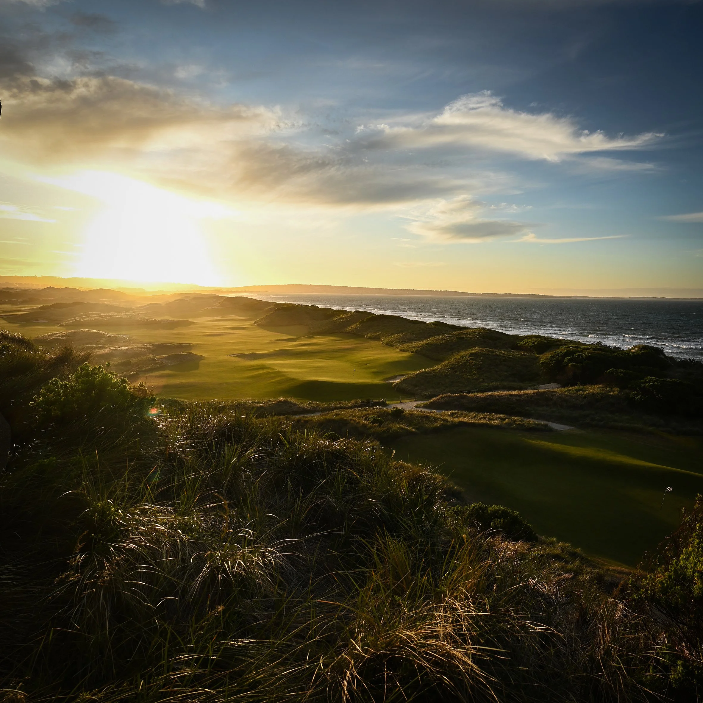 Stunning sunset at Barnbougle in Tasmania overlooking the 18th golf hole and Anderson's Bay.