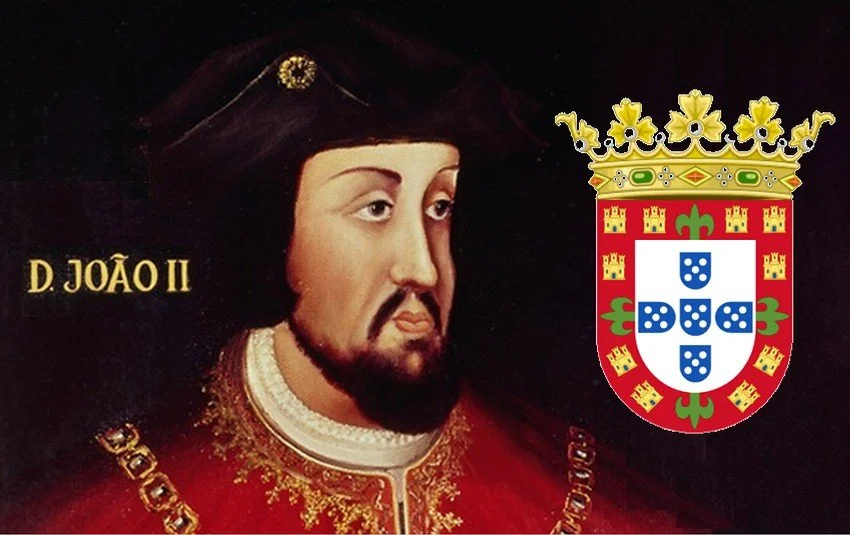 Painting of King John II of Portugal wearing a crown and royal garments, with a coat of arms featuring a crown and shield with blue fields and white symbols.
