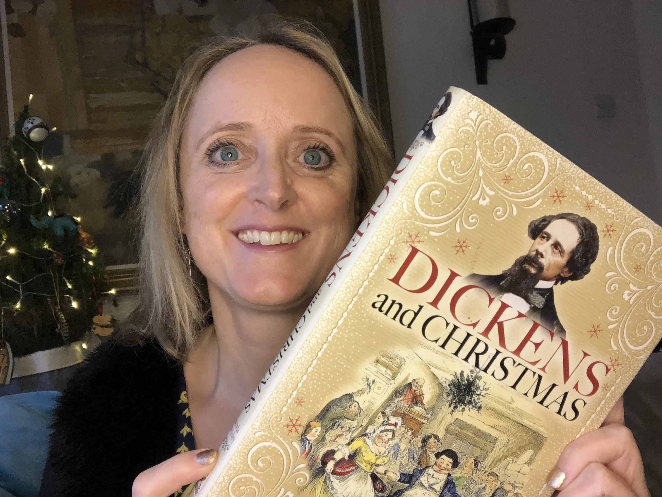 LH with Dickens and Christmas book.JPG