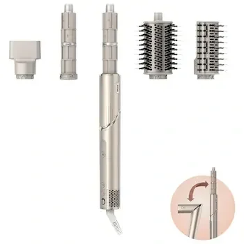 stylist-approved hairstyling faves tools products that make styling easy 2025 flat lay on salon counter