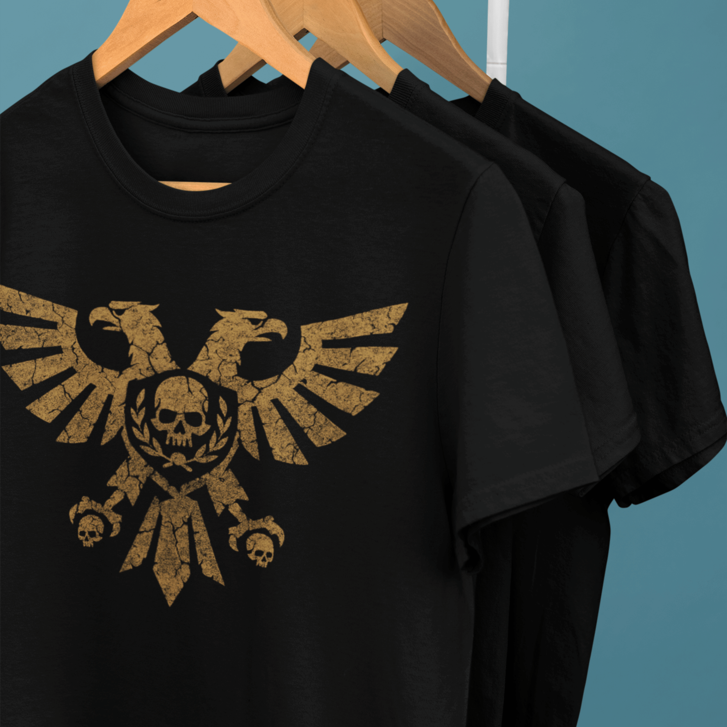 clothes rack of Warhammer 40k tshirts with gold aquila symbol in gold