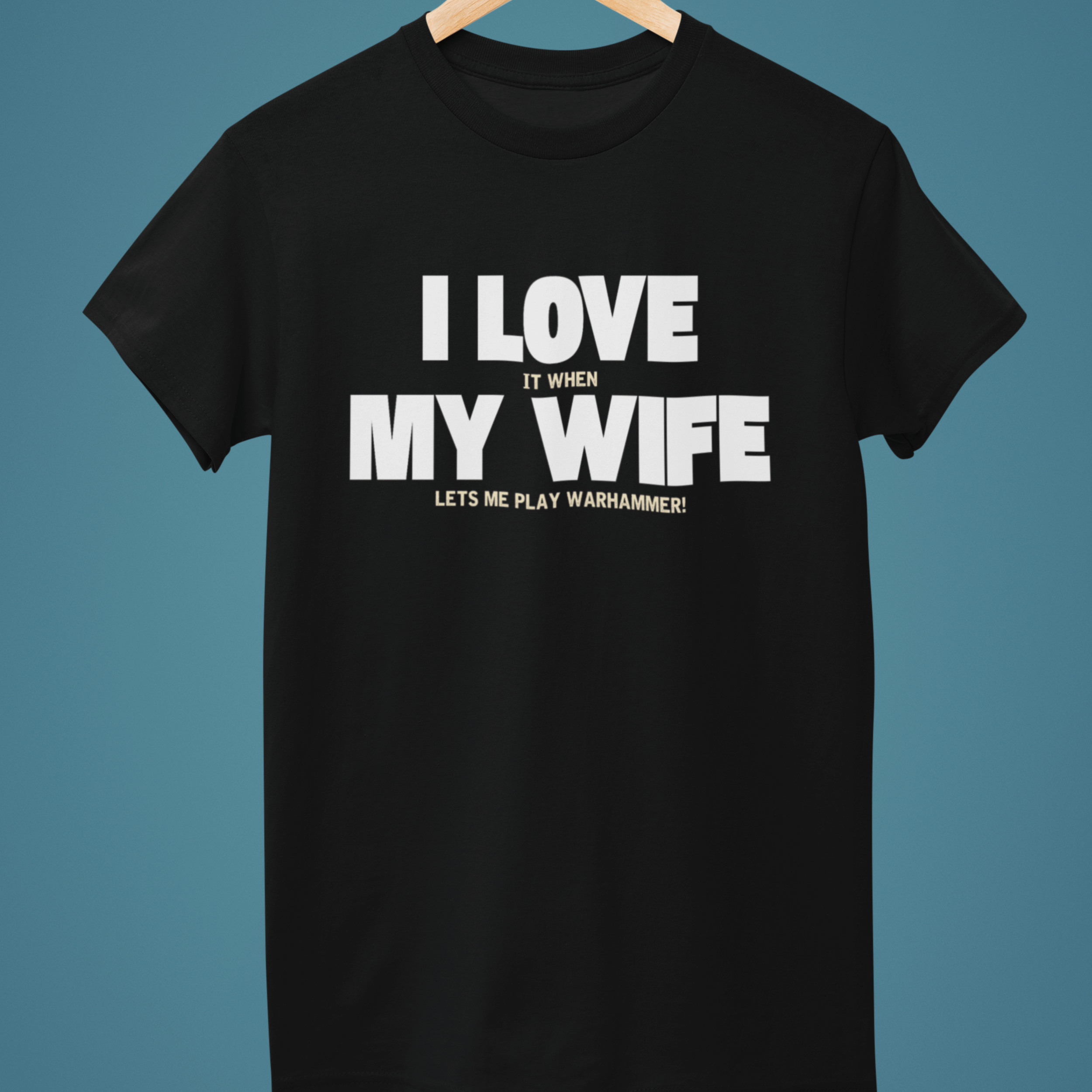 Black Funny Warhammer t-shirt for husbands with wording "I love it when my wife lets me play warhammer!"