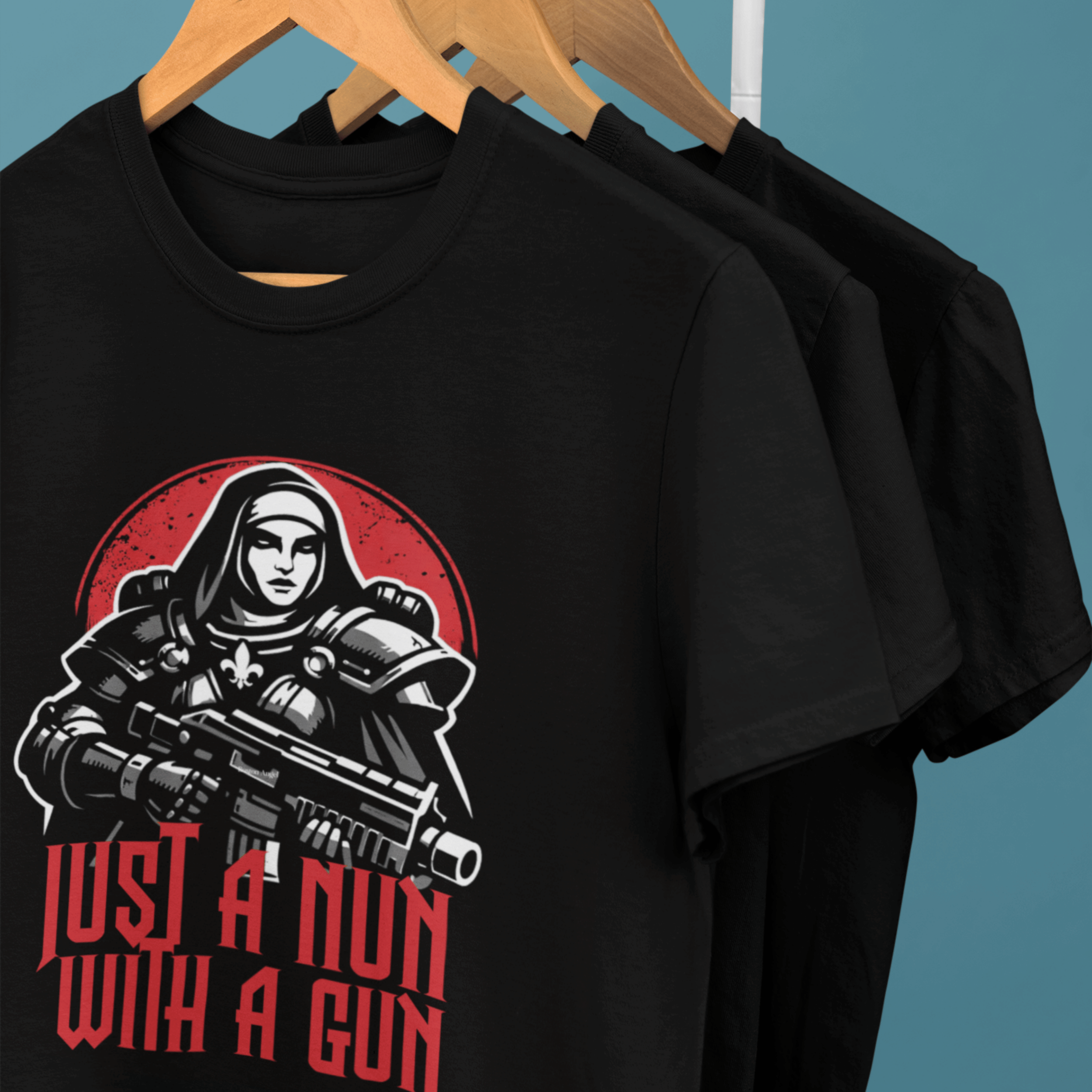 clothes rack of Warhammer 40k Adepta Sororitas t-shirts featuring "just a nun with a gun" graphic