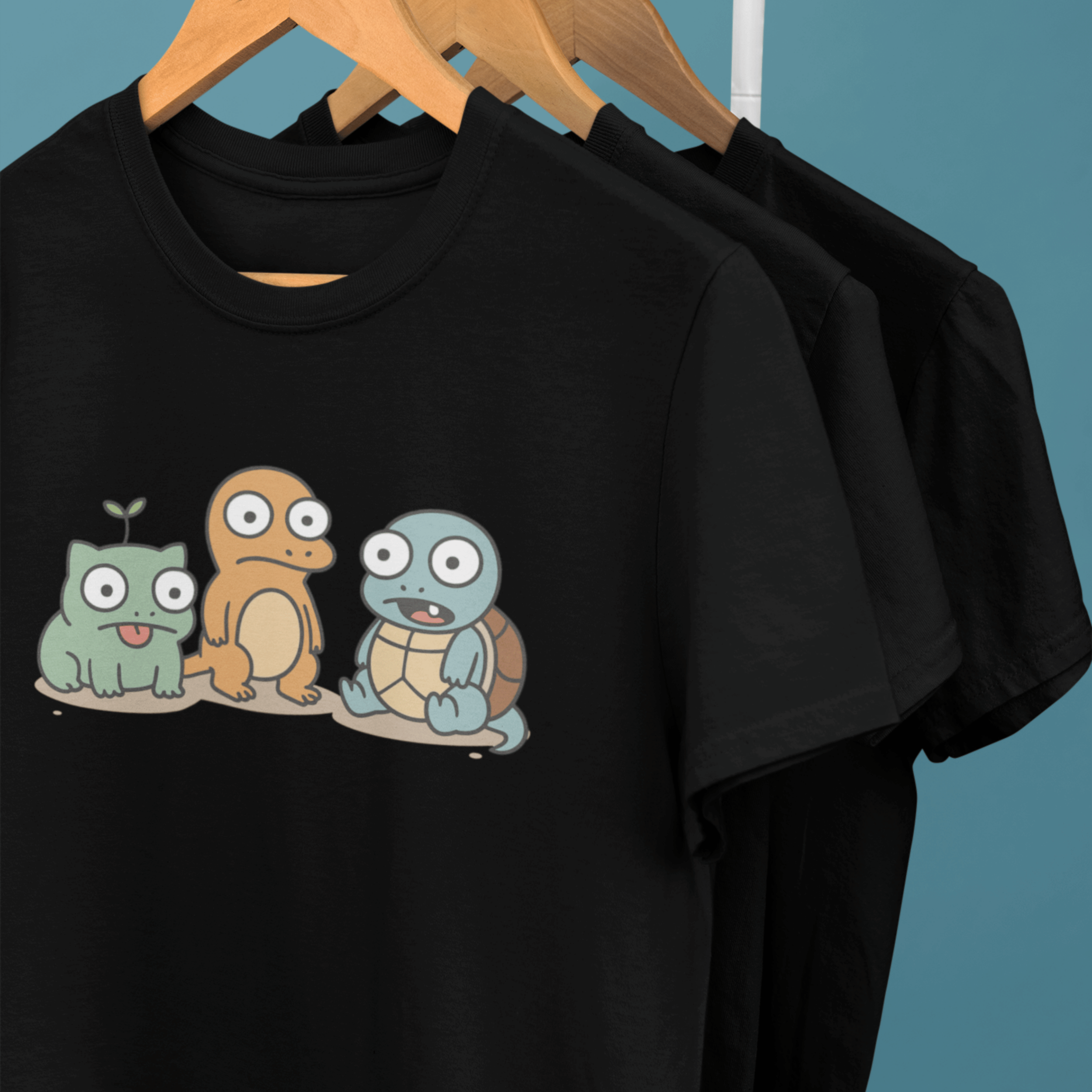 clothes rack of funny pokemon t-shirts with derpy starters
