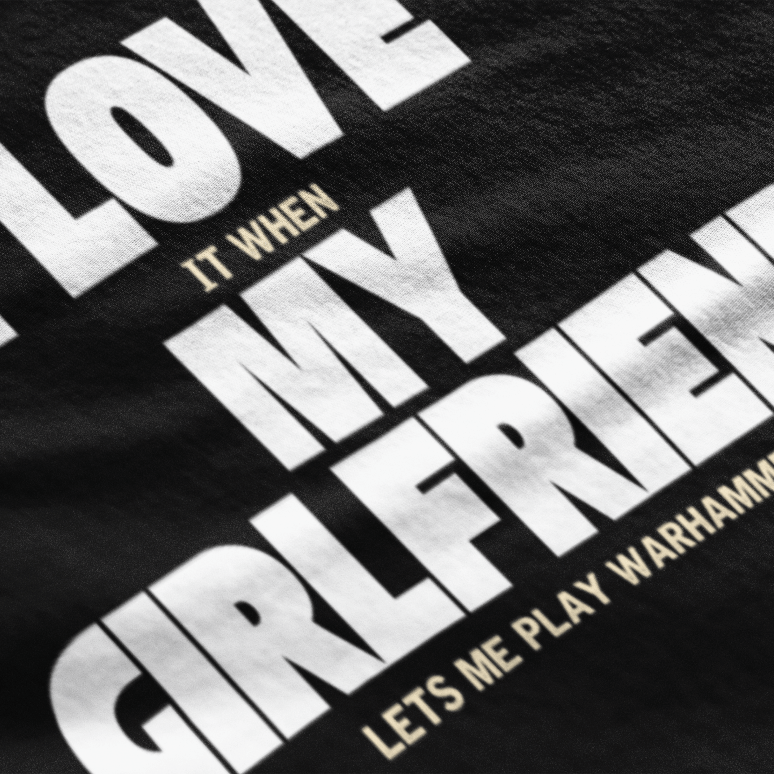 close up of Funny warhammer t-shirt for boyfriend with slogan "I love it when my girlfriend lets me play warhammer!"