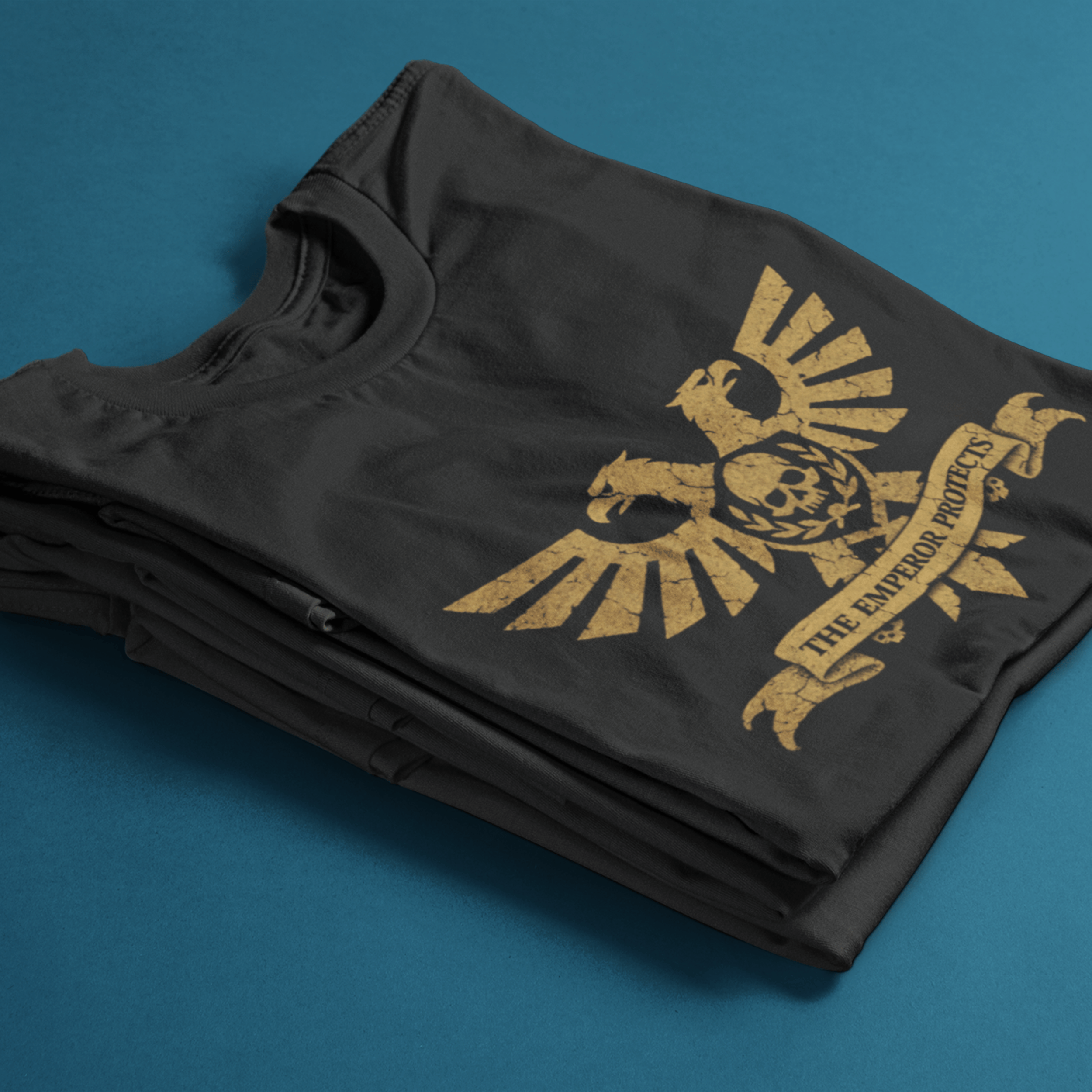 folded Warhammer 40k tshirt with aquila and classic quote "the emperor protects"