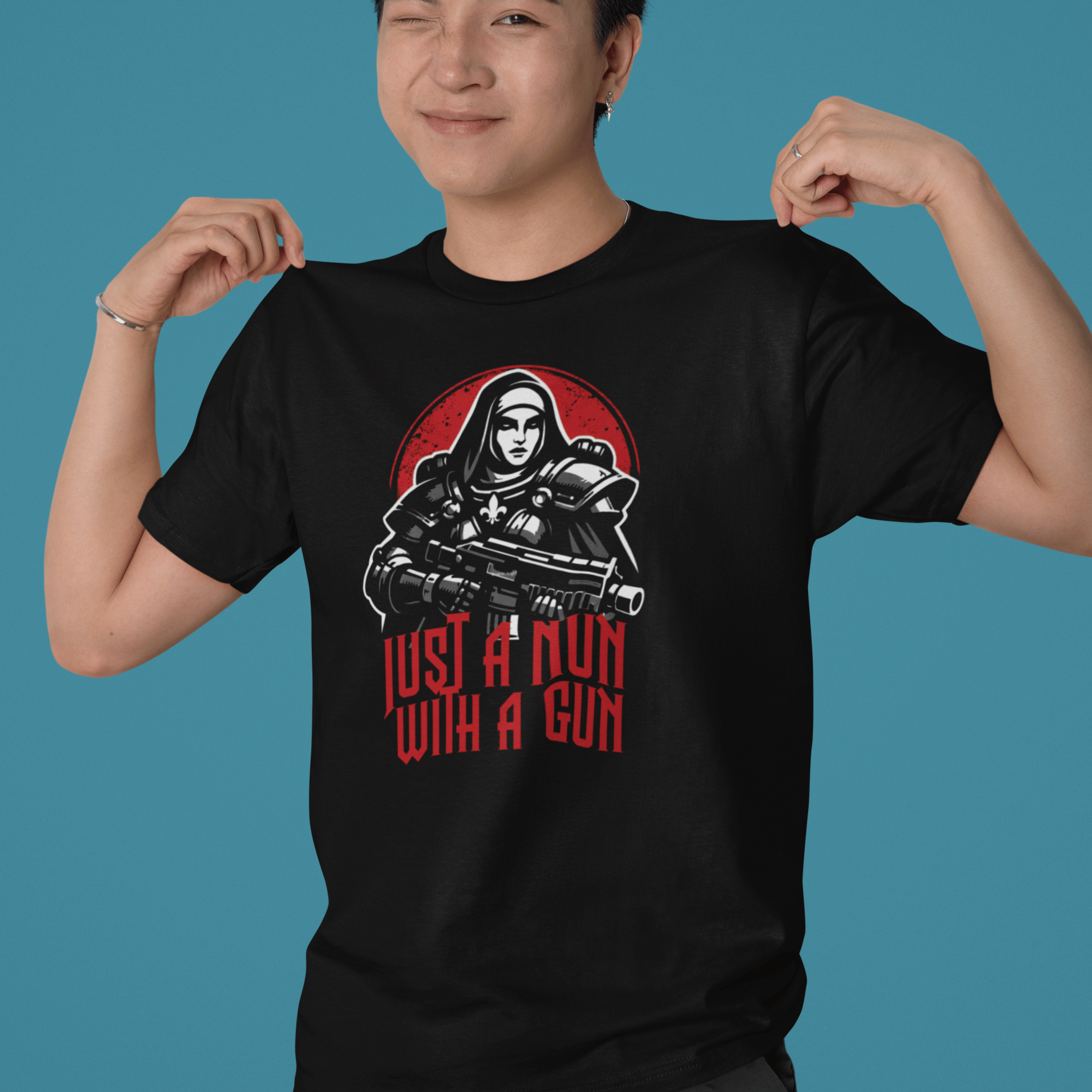 man pointing to Warhammer 40k Adepta Sororitas t-shirt featuring "just a nun with a gun" graphic