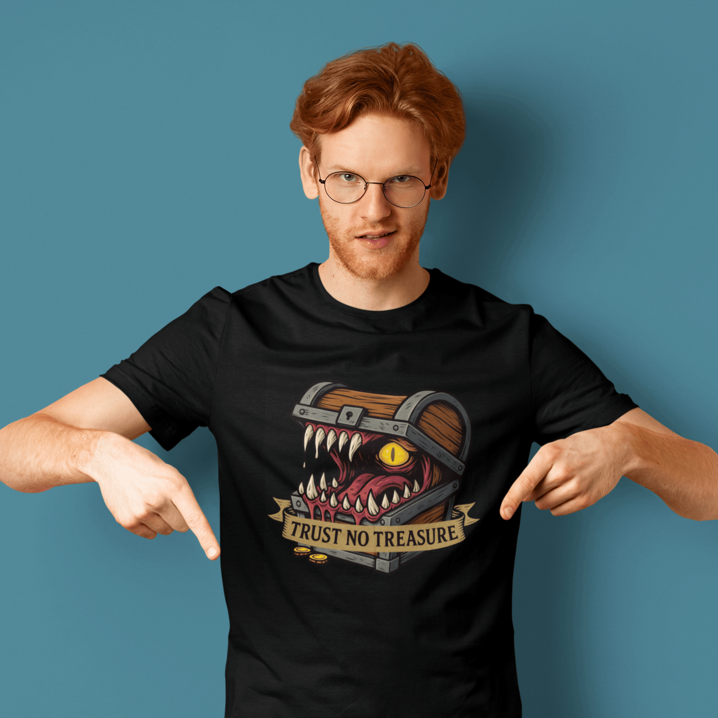 close up of man wearing D&D mimic t-shirt with monster treasure chest as slogan "trust no treasure"