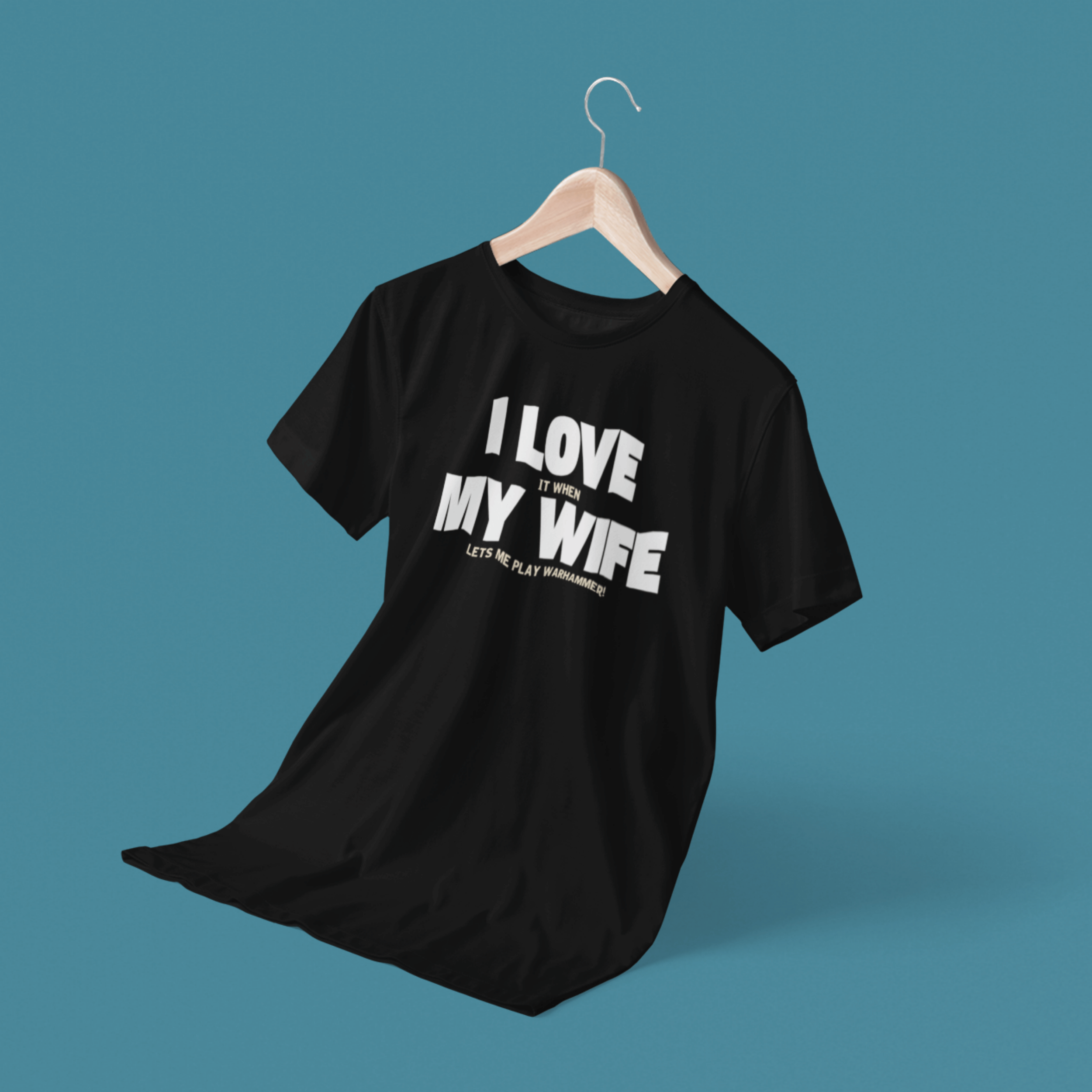 floating Funny Warhammer t-shirt for husbands with wording "I love it when my wife lets me play warhammer!"