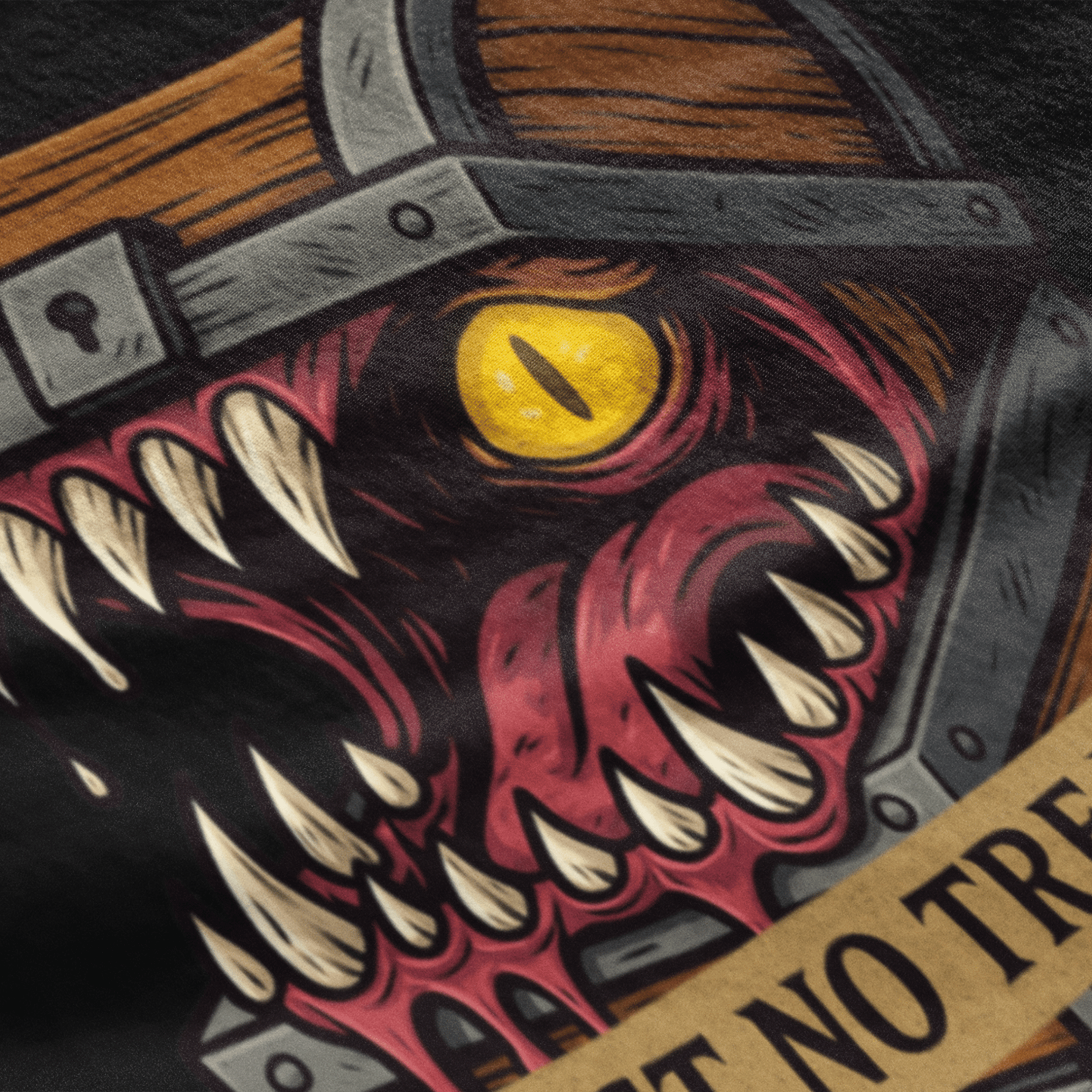 close up of D&D mimic t-shirt with monster treasure chest as slogan "trust no treasure"
