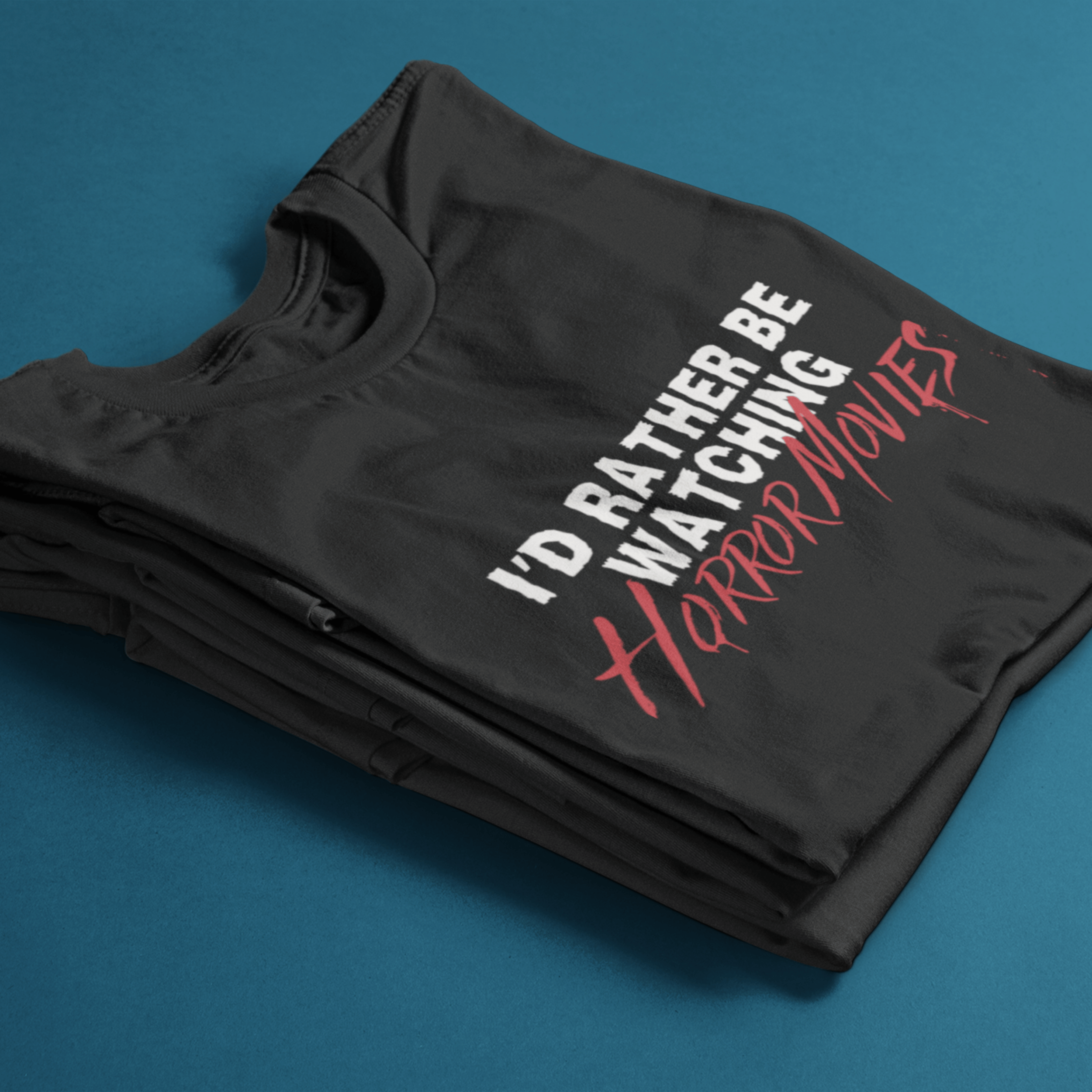 folded horror movie t-shirt with text "I'd rather be watching horror movies"