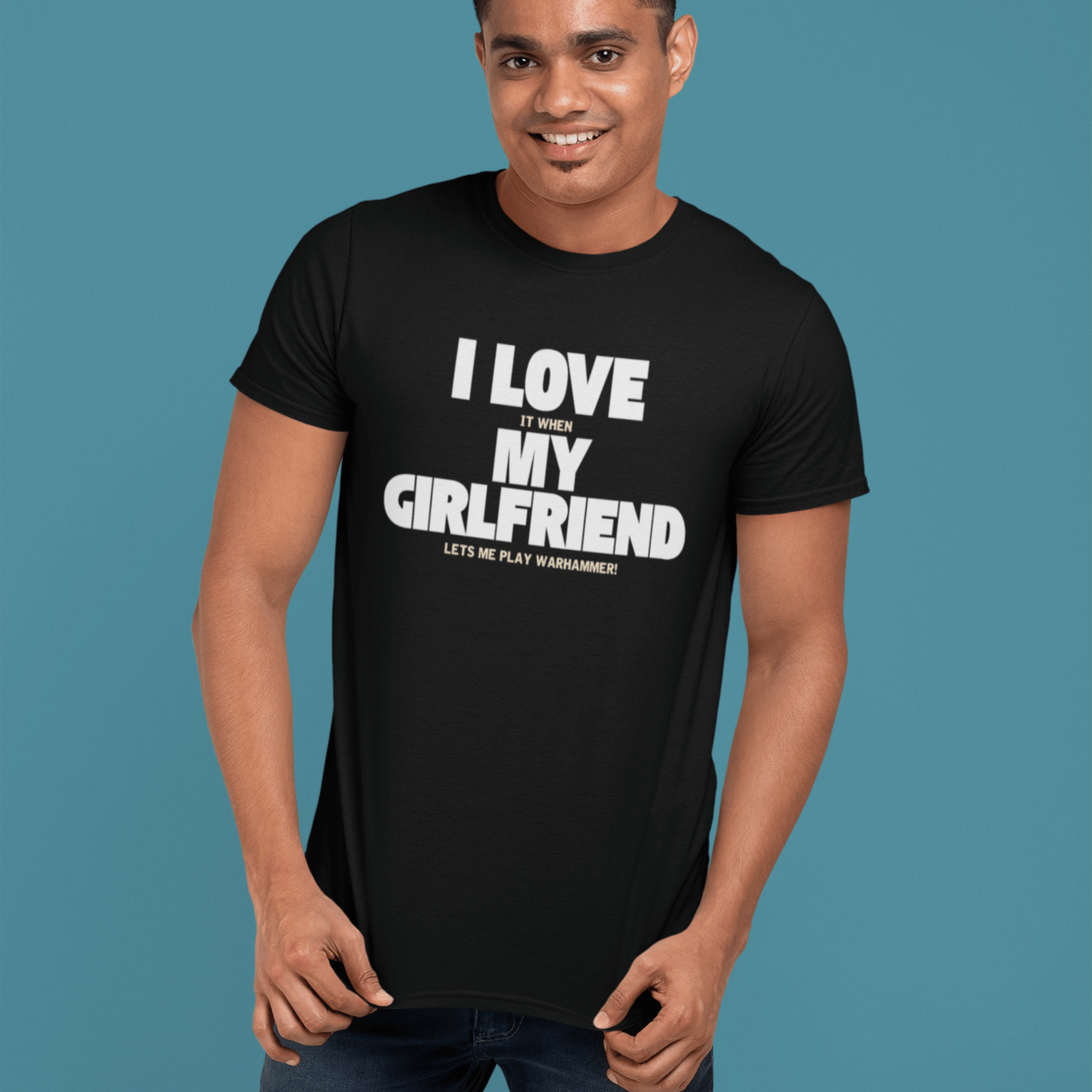 man wearing Funny warhammer t-shirt for boyfriend with slogan "I love it when my girlfriend lets me play warhammer!"