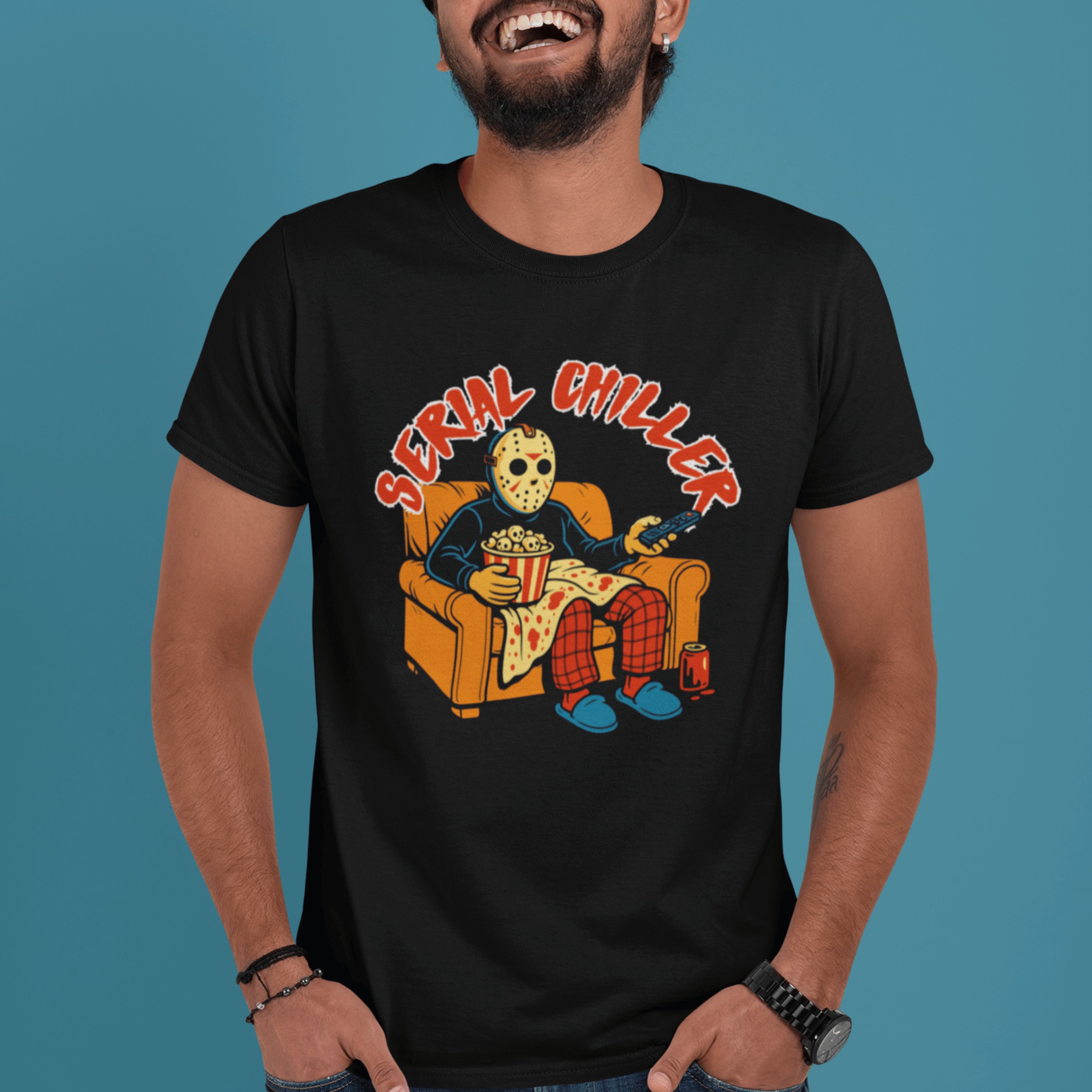 man wearing horror movie lover t-shirt with jason vorhees watching slasher movies