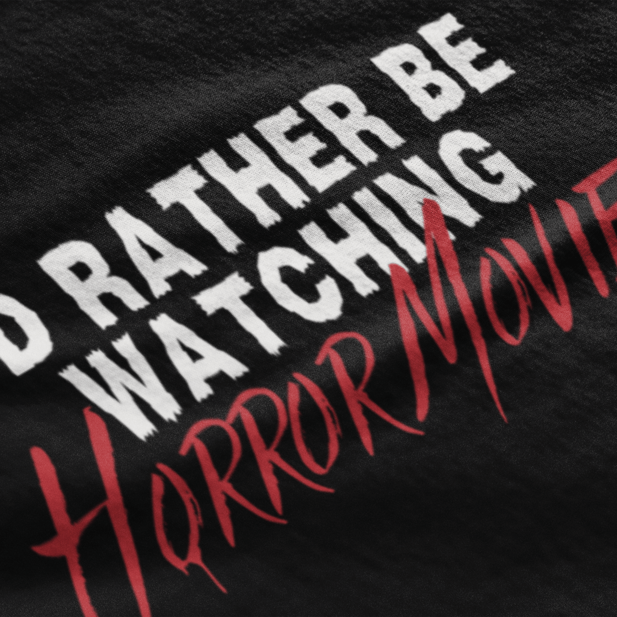 close up of horror movie t-shirt with text "I'd rather be watching horror movies"