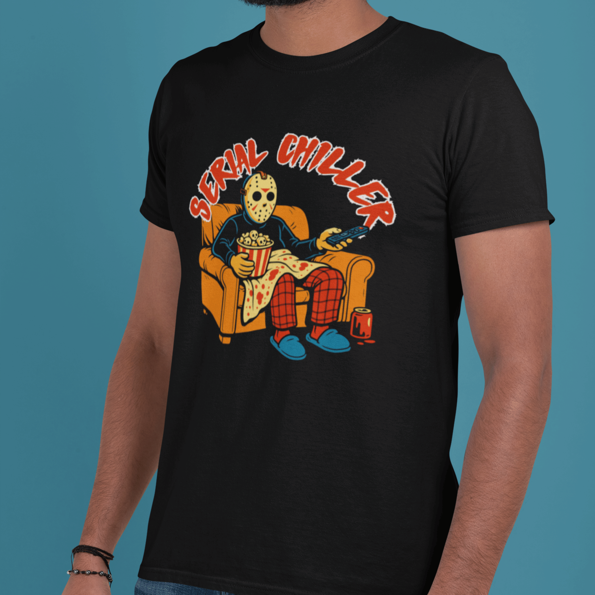 close up of man wearing horror movie lover t-shirt with jason vorhees watching slasher movies