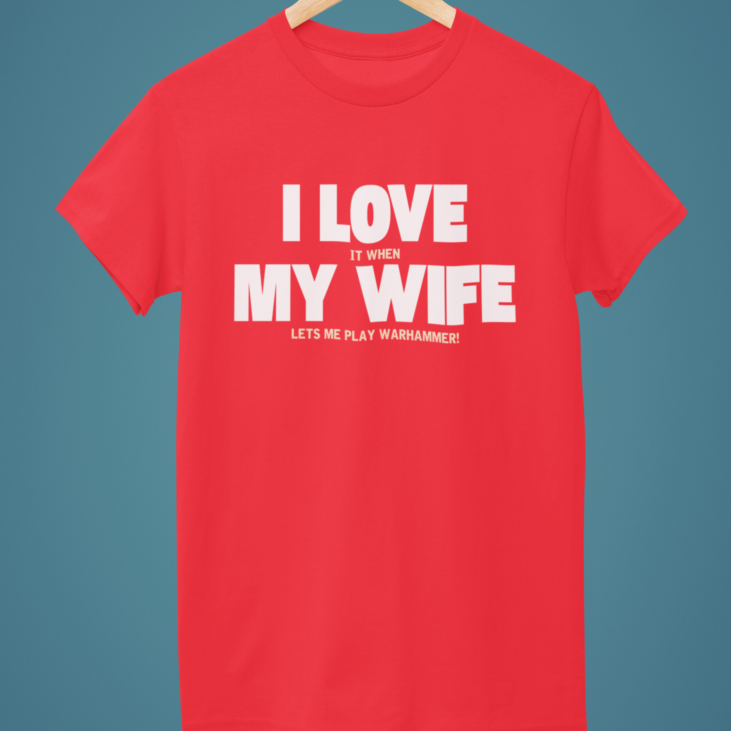 Red Funny Warhammer t-shirt for husbands with wording "I love it when my wife lets me play warhammer!"