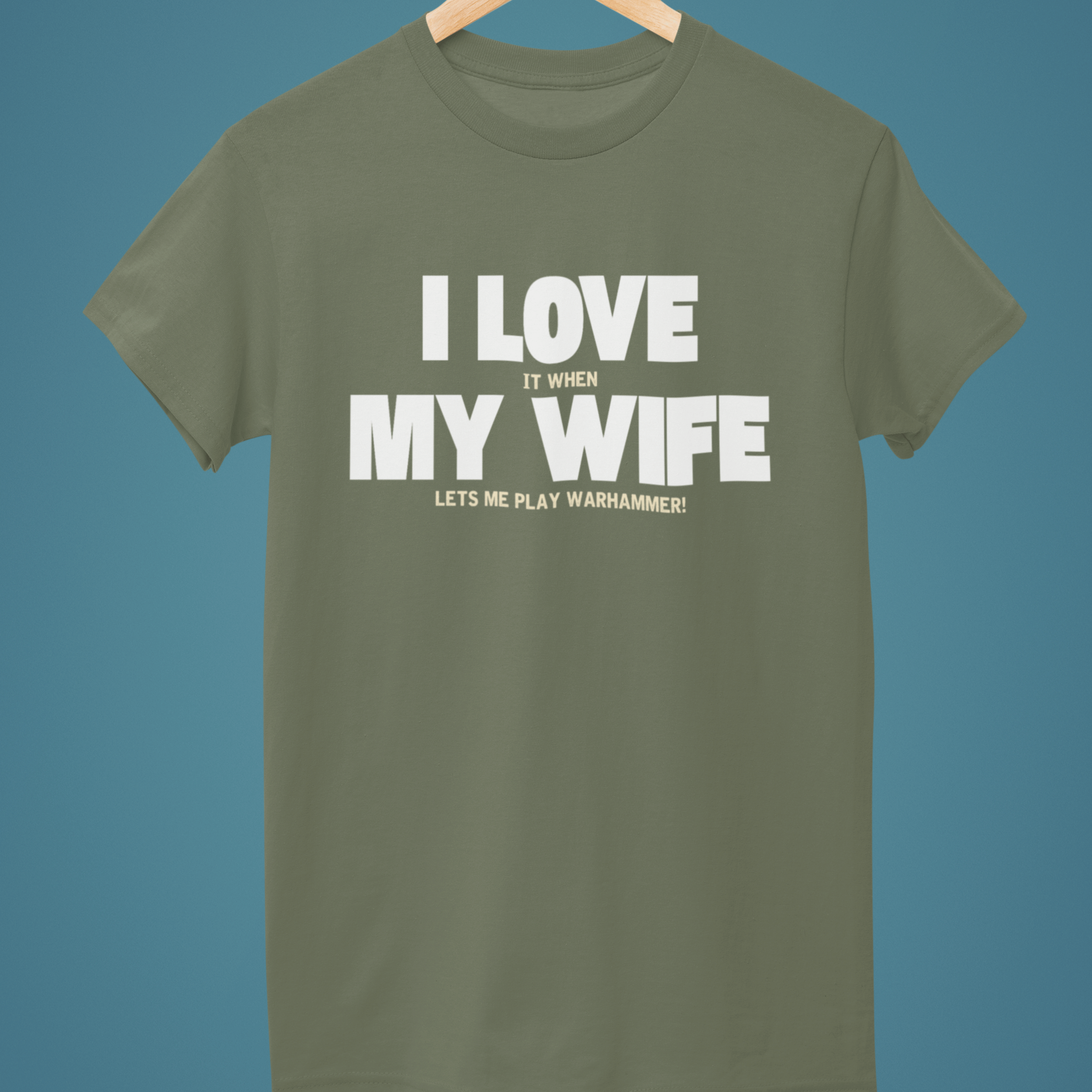 Green Funny Warhammer t-shirt for husbands with wording "I love it when my wife lets me play warhammer!"