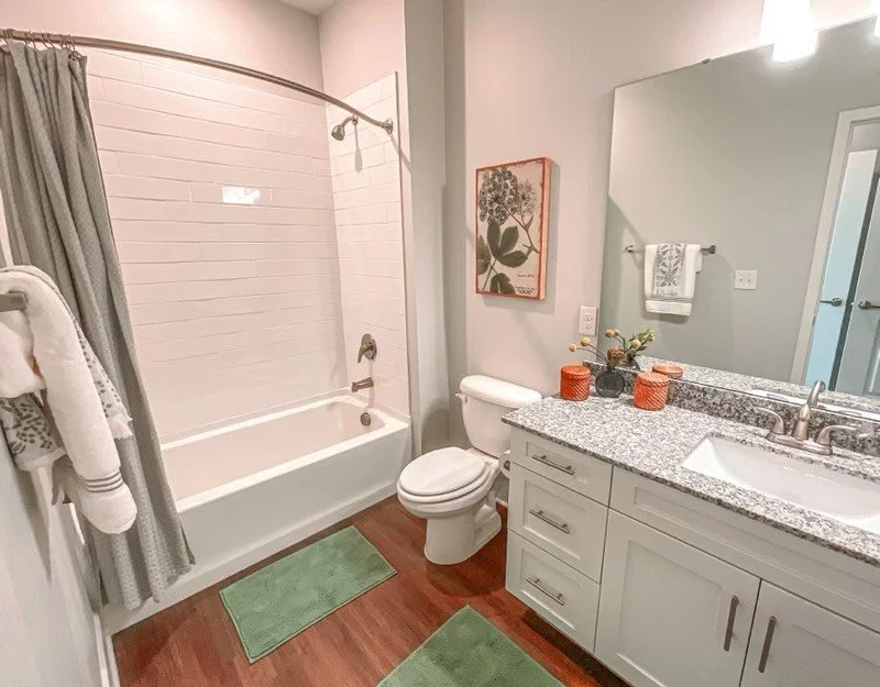 Typical bathroom with a tub, toilet and sink in the Courtney Ridge multifamily apartment complex - Charlotte, NC