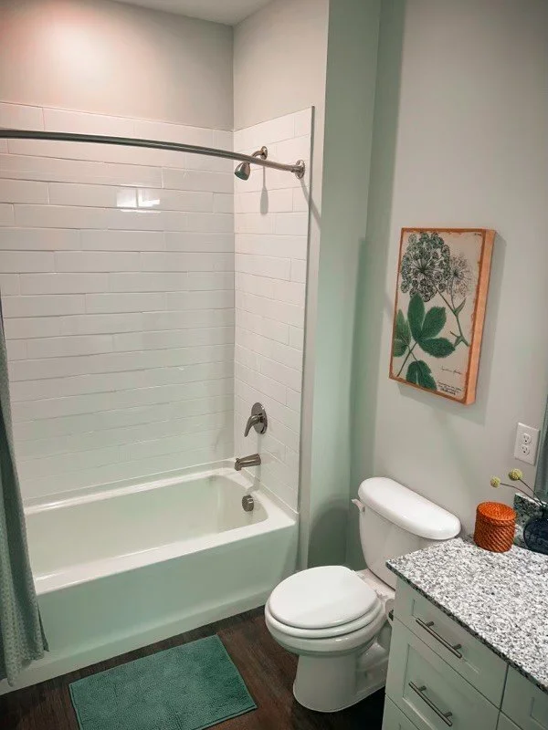 Typical bathroom with a tub, toilet and sink in the Courtney Ridge multifamily apartment complex - Charlotte, NC