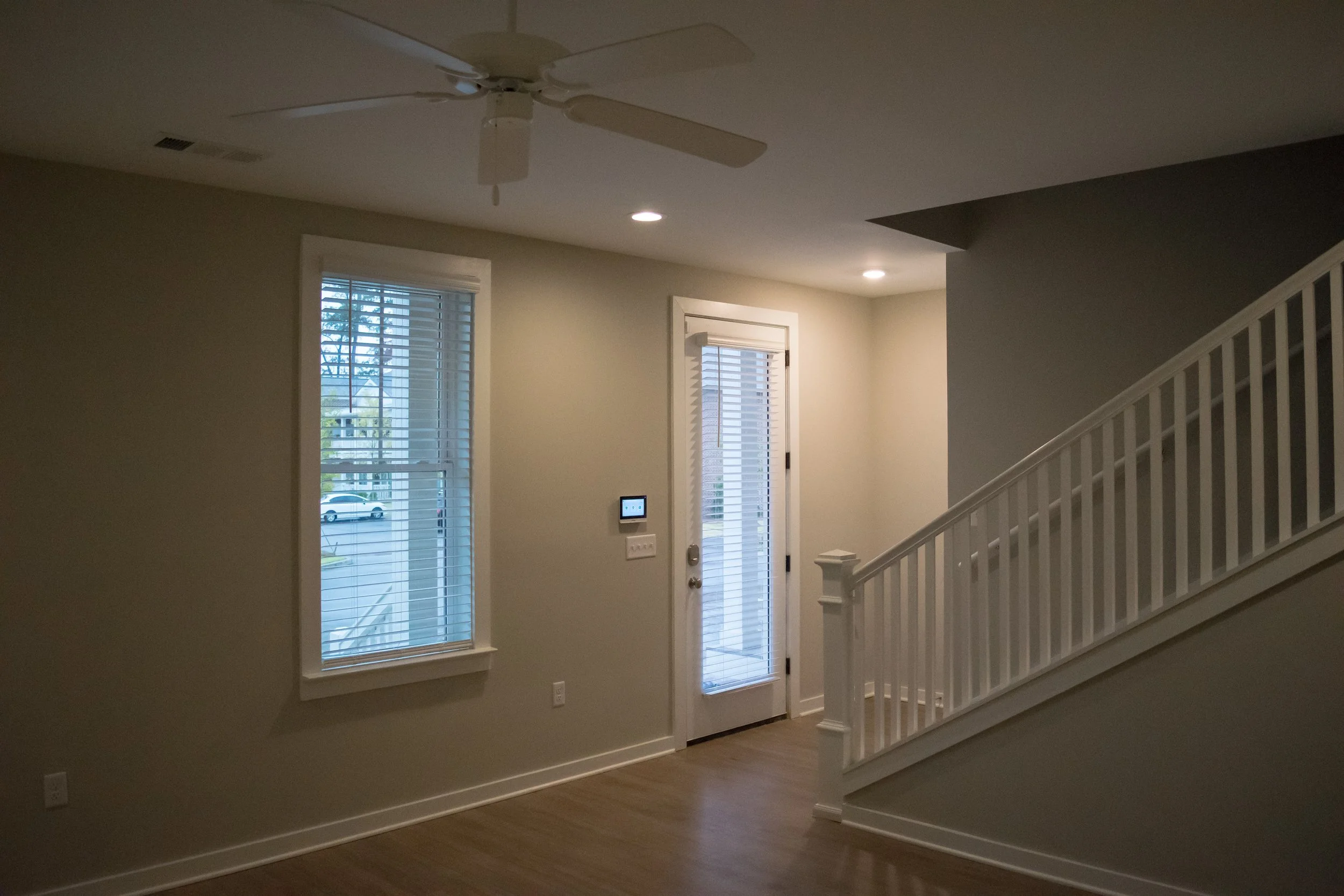 Living area and stairway in the Old Town Townhomes multifamily townhome complex - Columbus, GA