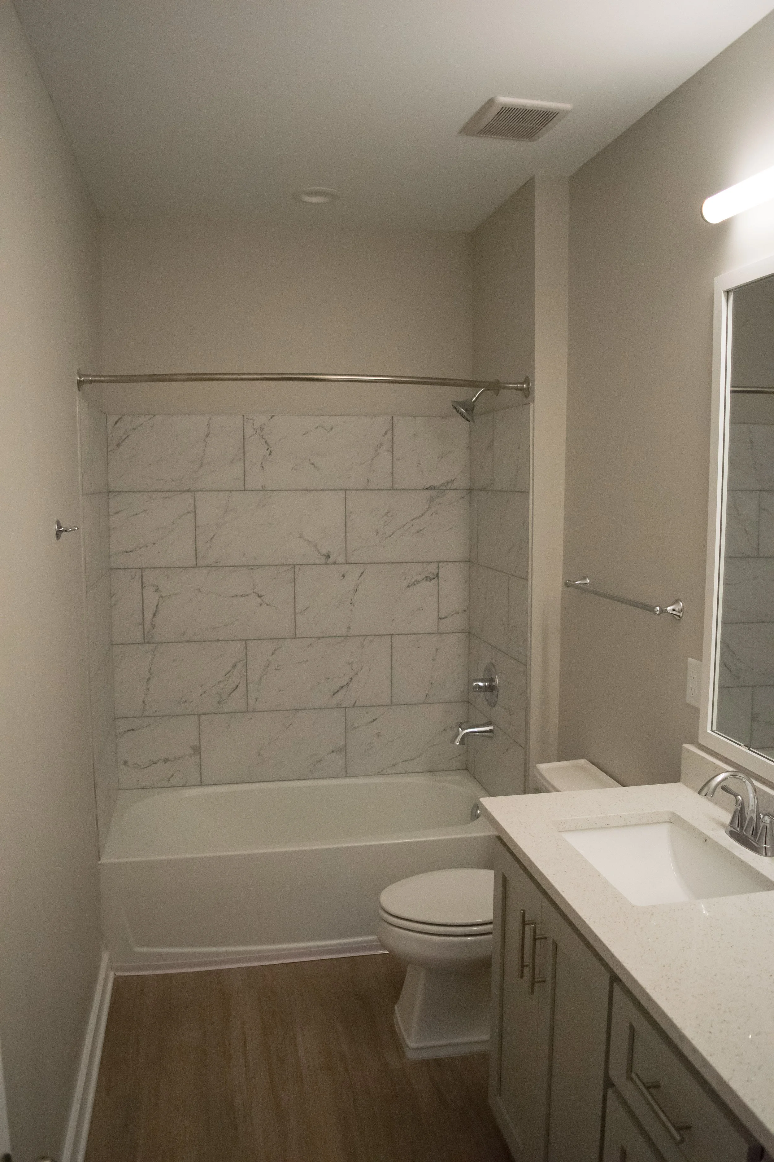 A typical bathroom with a tub and toilet in the multifamily townhome complex Old Town Townhomes - Columbus, GA