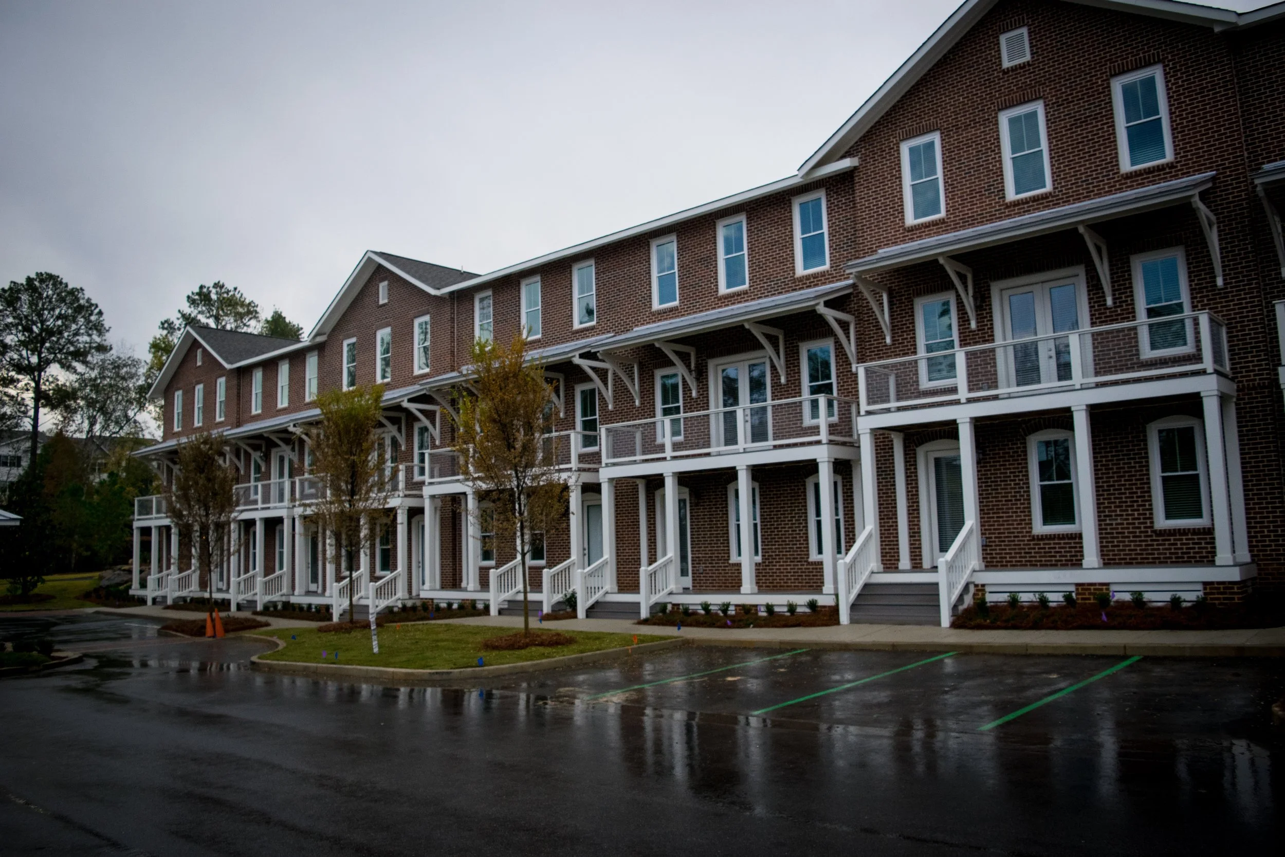 Photo of the front facade of the Old Town Townhomes during a cloudy day - Columbus, GA