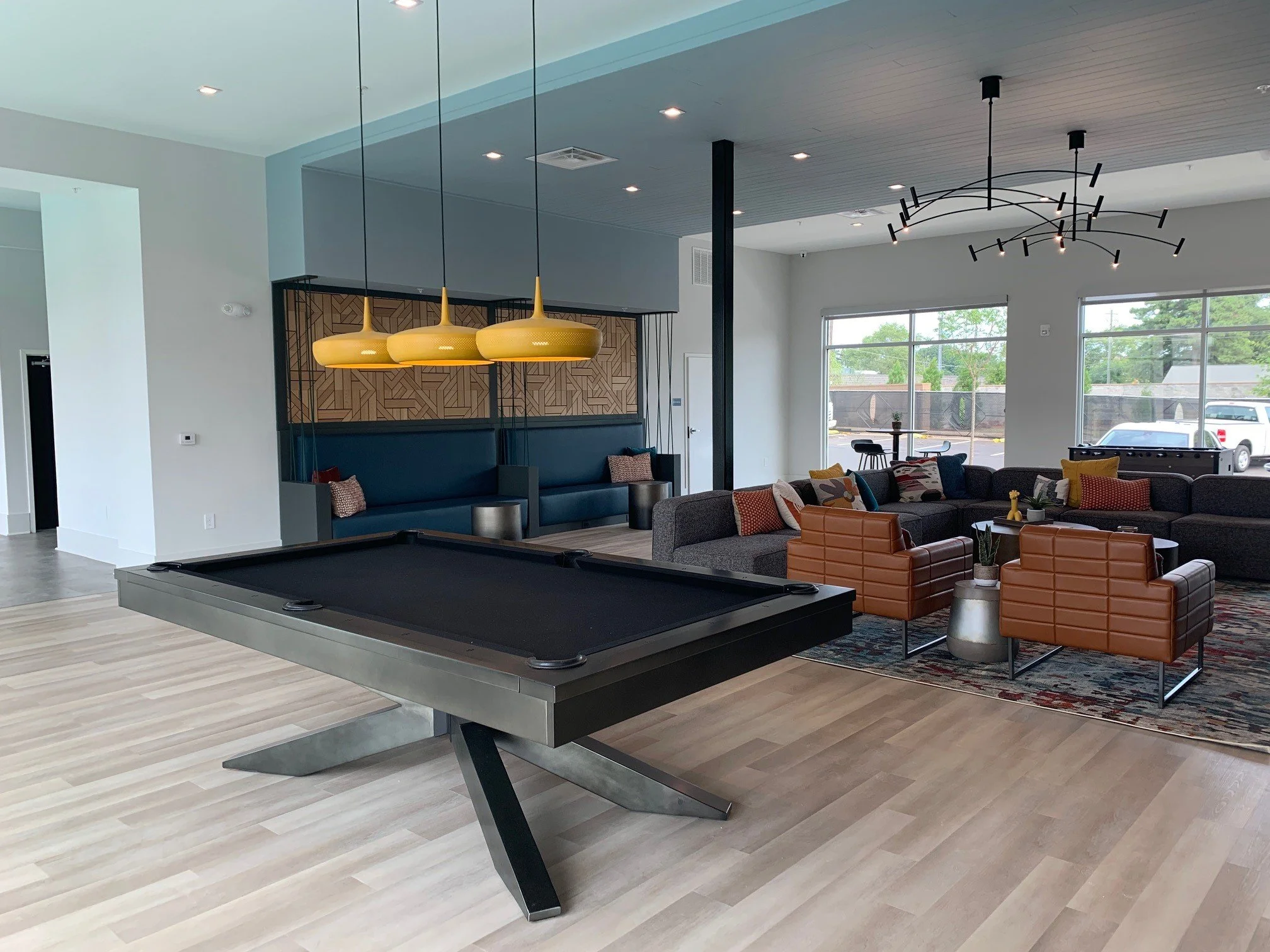 Common area with a pool table and some chairs located within The Beacon - Kennesaw, GA