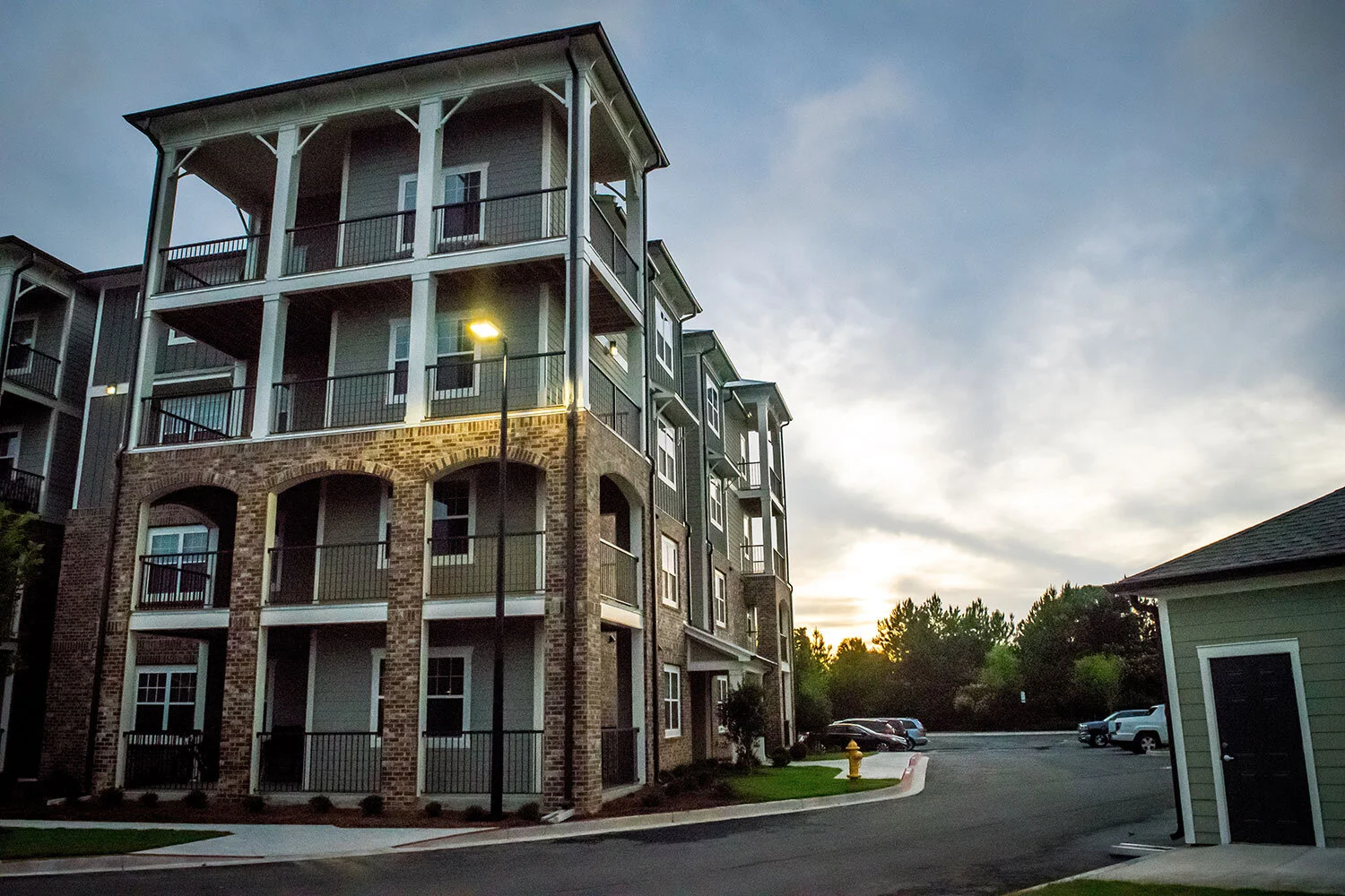 Low-angle shot of multifamily apartment complex units during sunset at the Riverpoint - Rome, GA