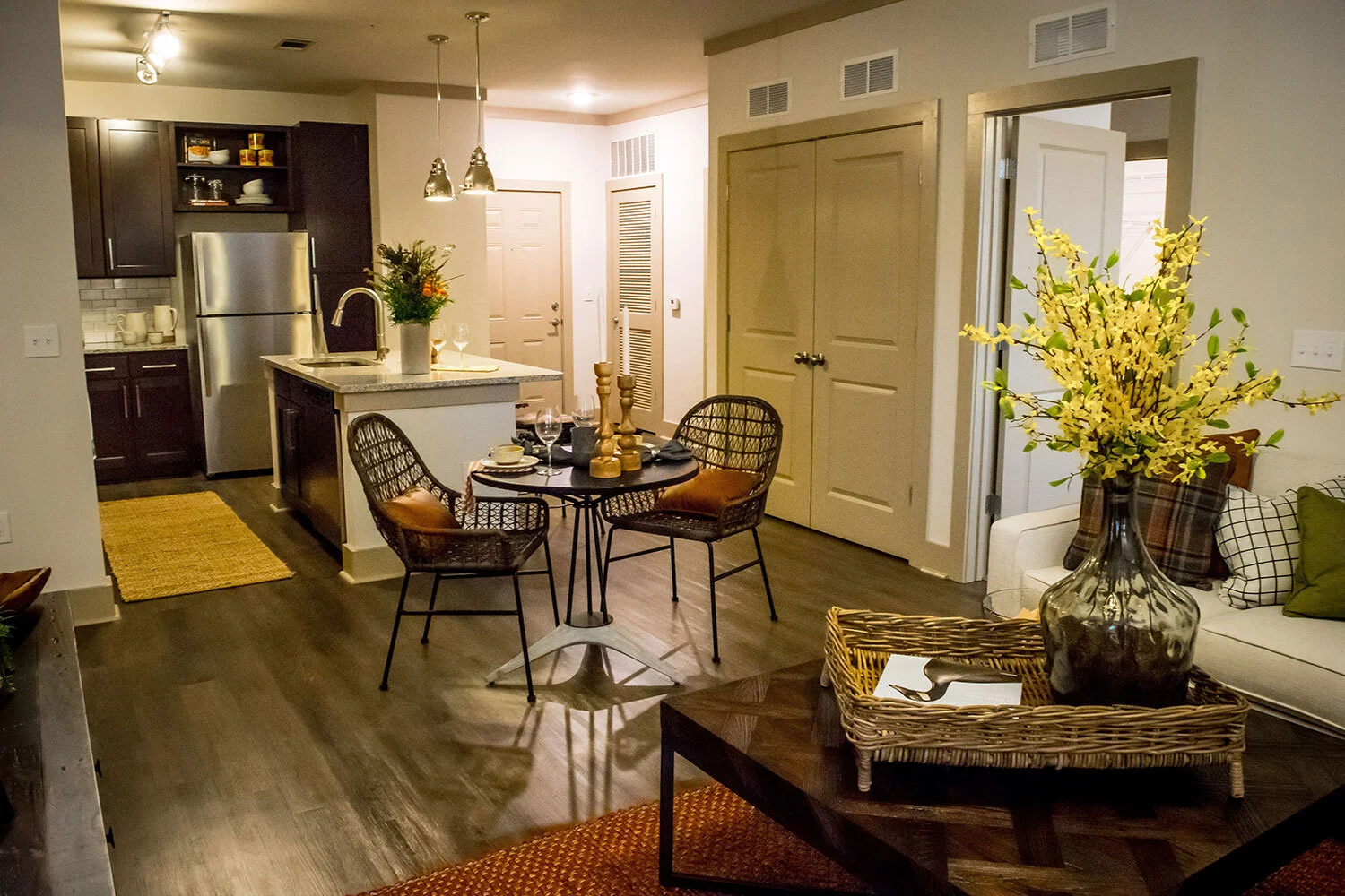 Typical multifamily apartment unit with a breakfast nook, kitchen and island seen at Riverpoint - Rome, GA