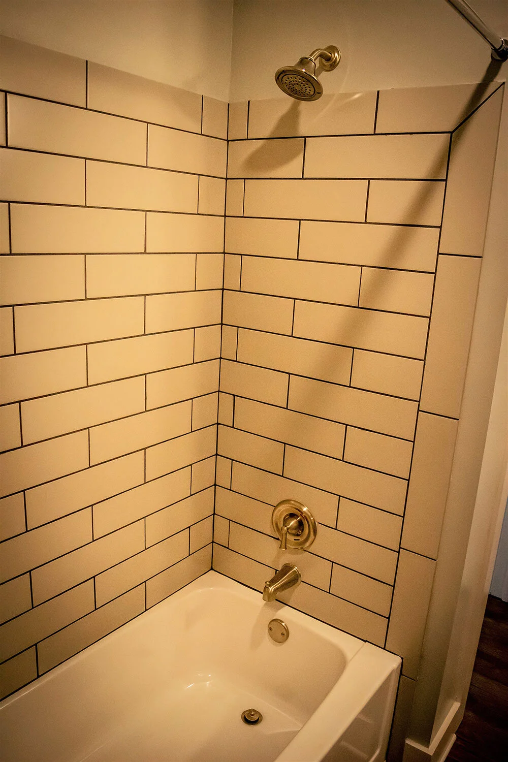 Bathroom with tub in a typical multifamily complex unit at City of Refuge - Atlanta, GA
