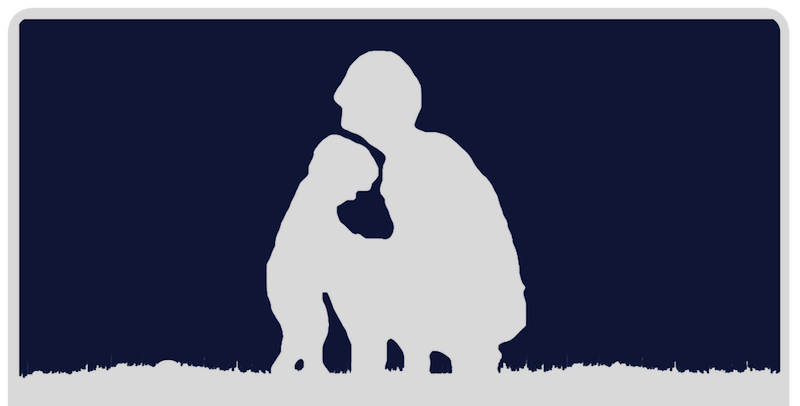 Silhouette of a person kneeling next to a dog, with the person's arm around the dog, against a dark background.
