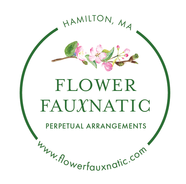 Logo for Flower Fauxnatic, a floral arrangement business in Hamilton, MA, featuring pink blossoms on a branch with green leaves, circular design with green text and website URL.