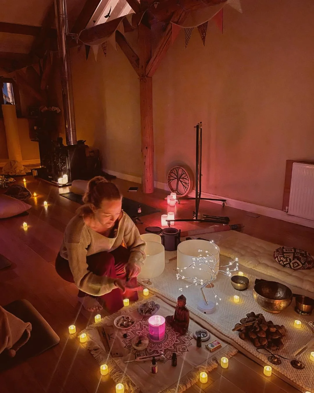 Relaxing sound bath, candles and meditation alter at a yoga event 