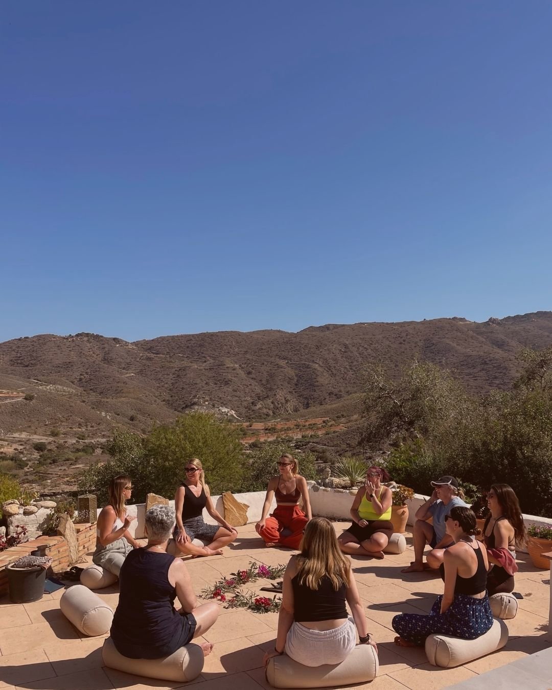 Small private yoga group practicing in studio