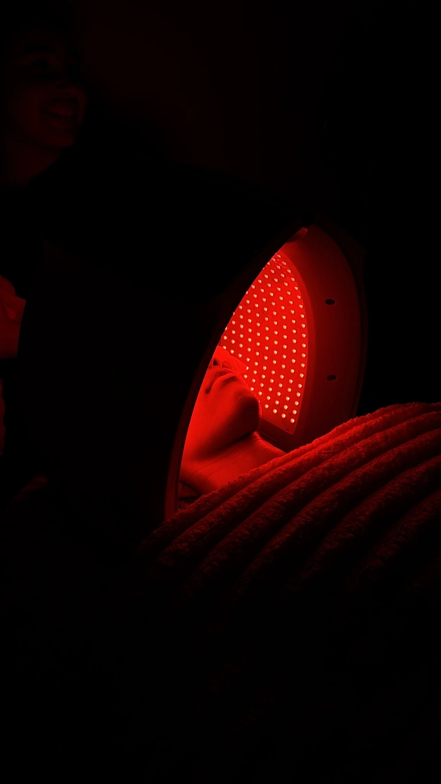 Client receiving professional LED light therapy to support skin healing and rejuvenation at PureSkn.cy.