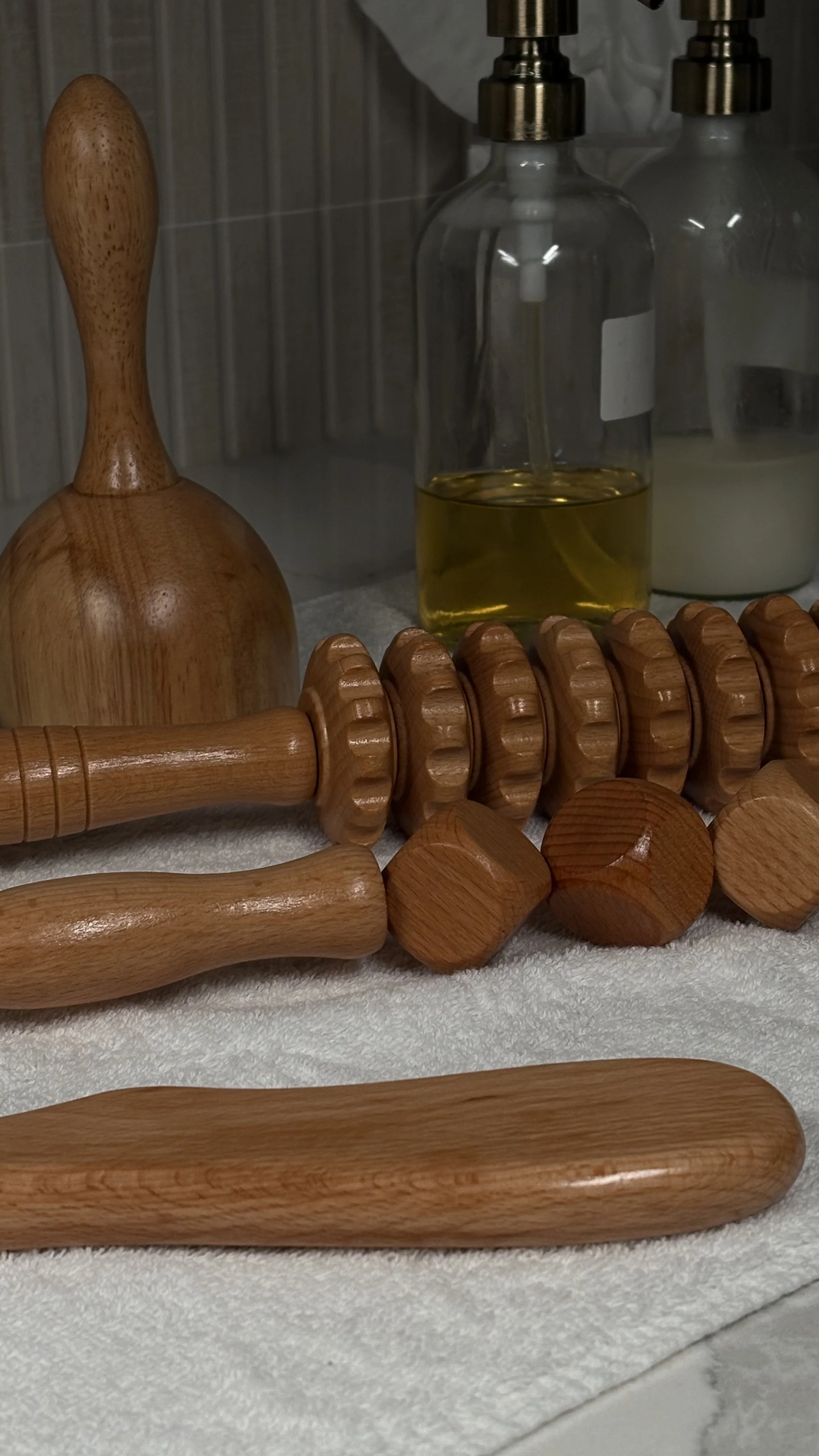 Wood therapy sculpting tools used in lymphatic-inspired contouring treatments at PureSkn.cy.