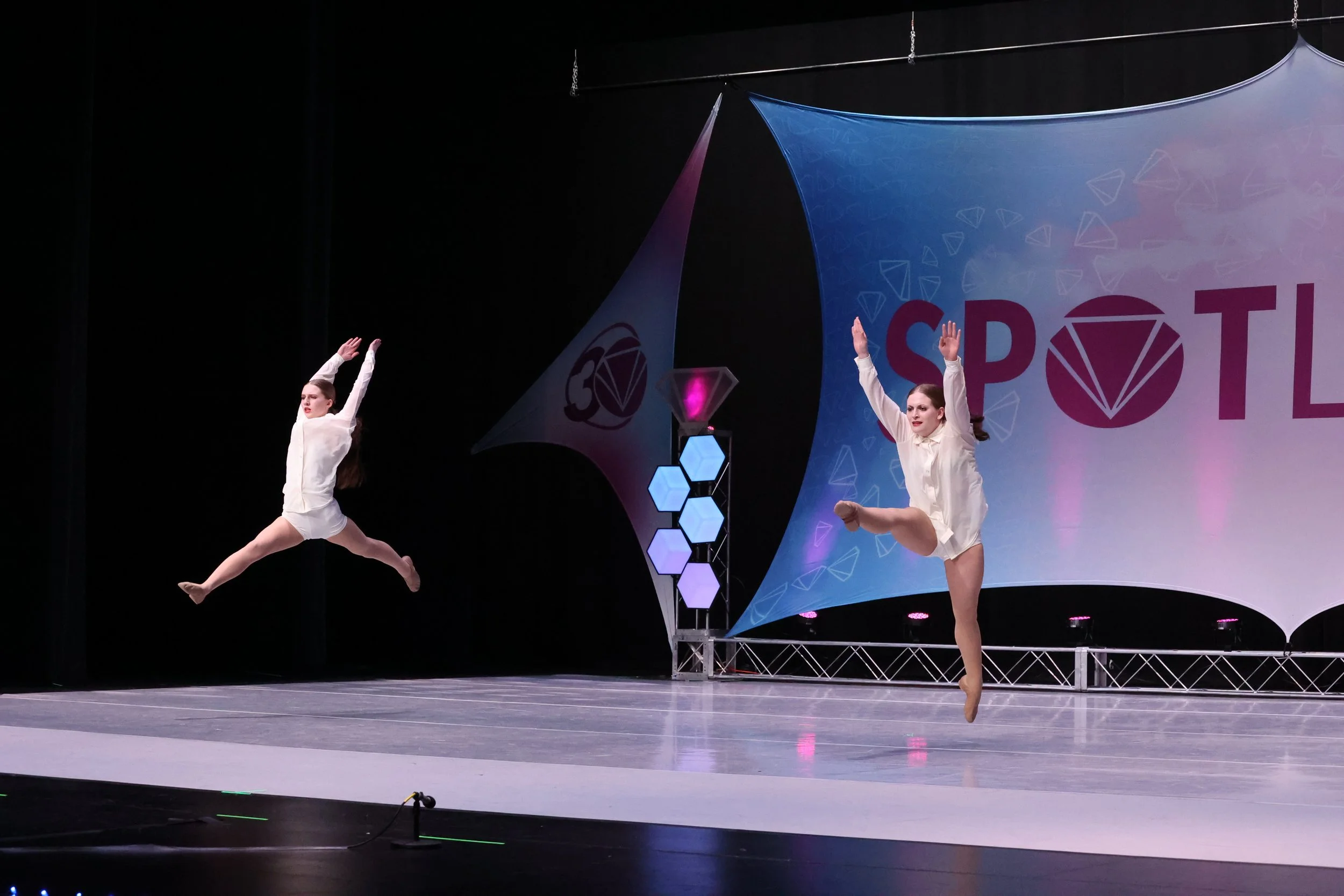 dancers performing duet on stage