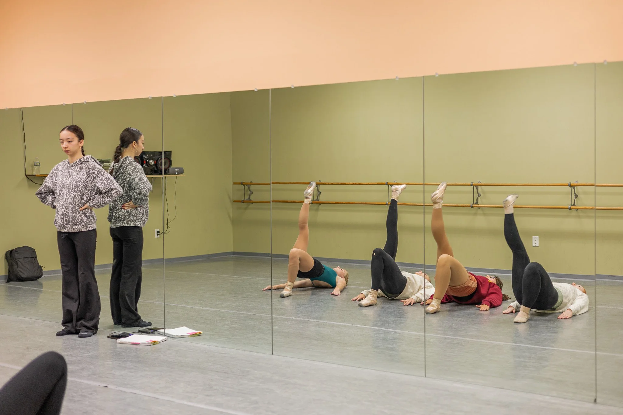 students doing stretches for ballet