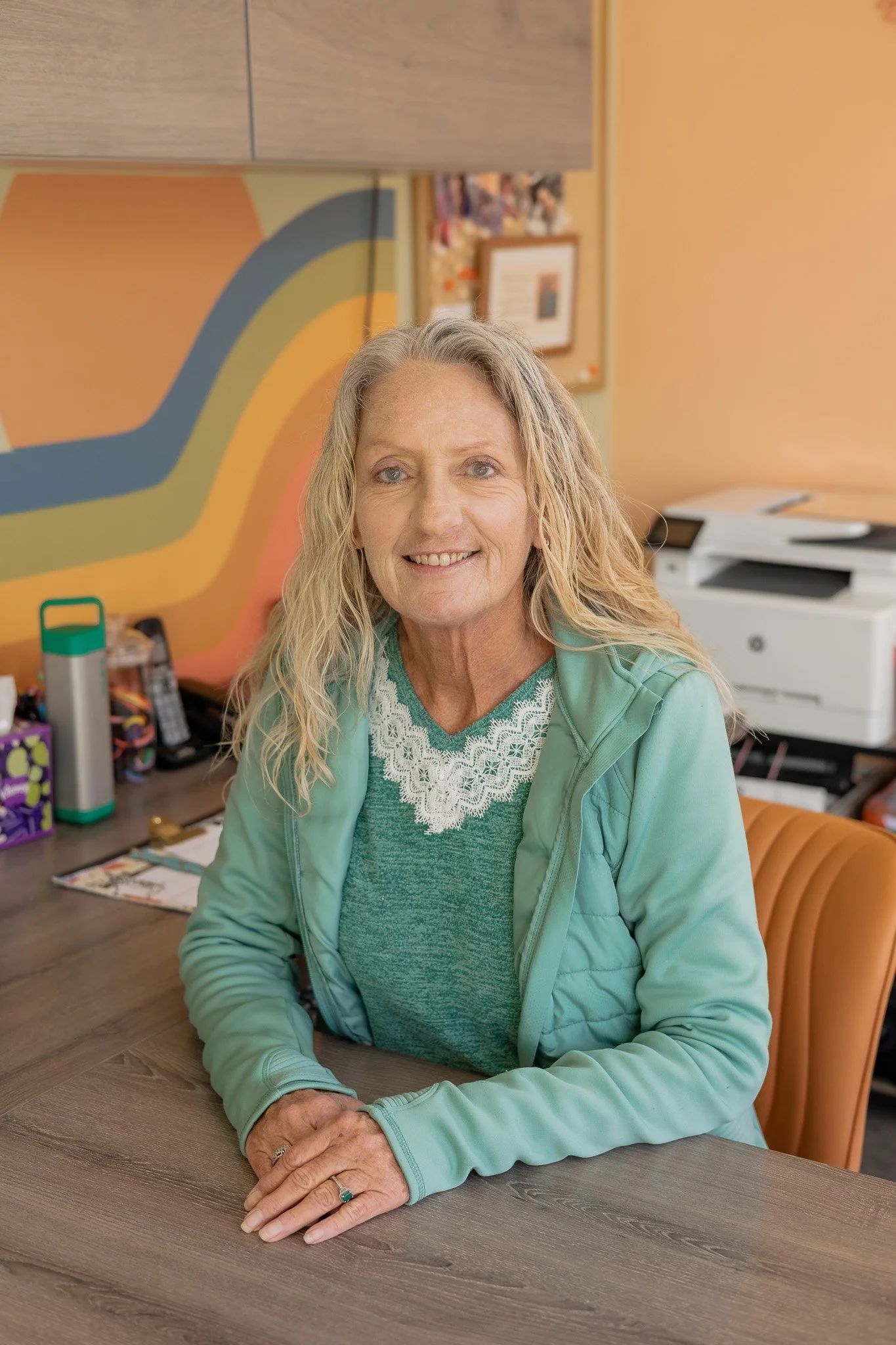 office manager headshot at desk