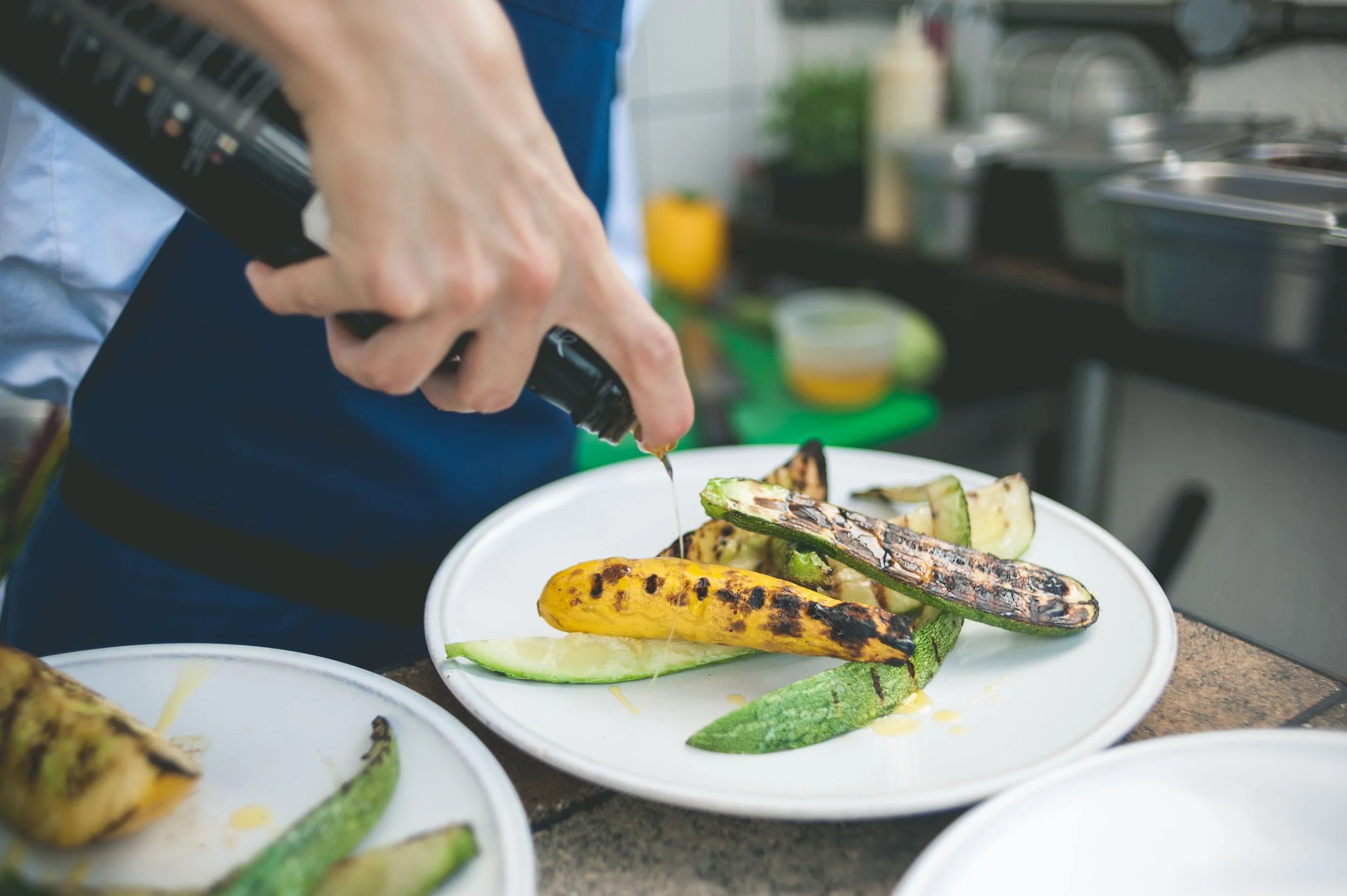 drizzling-olive-oil-bbq-courgette.jpg