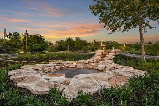Woodway, Texas landscaped park and water feature at sunset