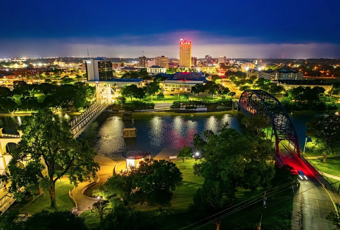Downtown Waco, Texas skyline at night along the Brazos River