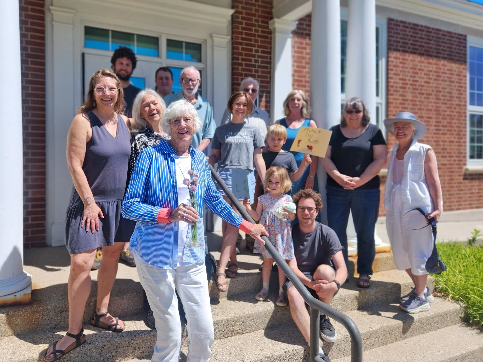 Members and families of Holland Friends Meeting gathered outside their worship space in Holland, Michigan.