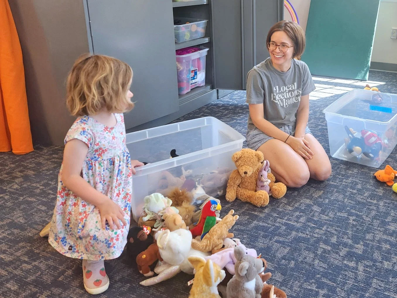 Child participating in First Day School with a volunteer at Holland Friends Meeting, where families and children are warmly welcomed.